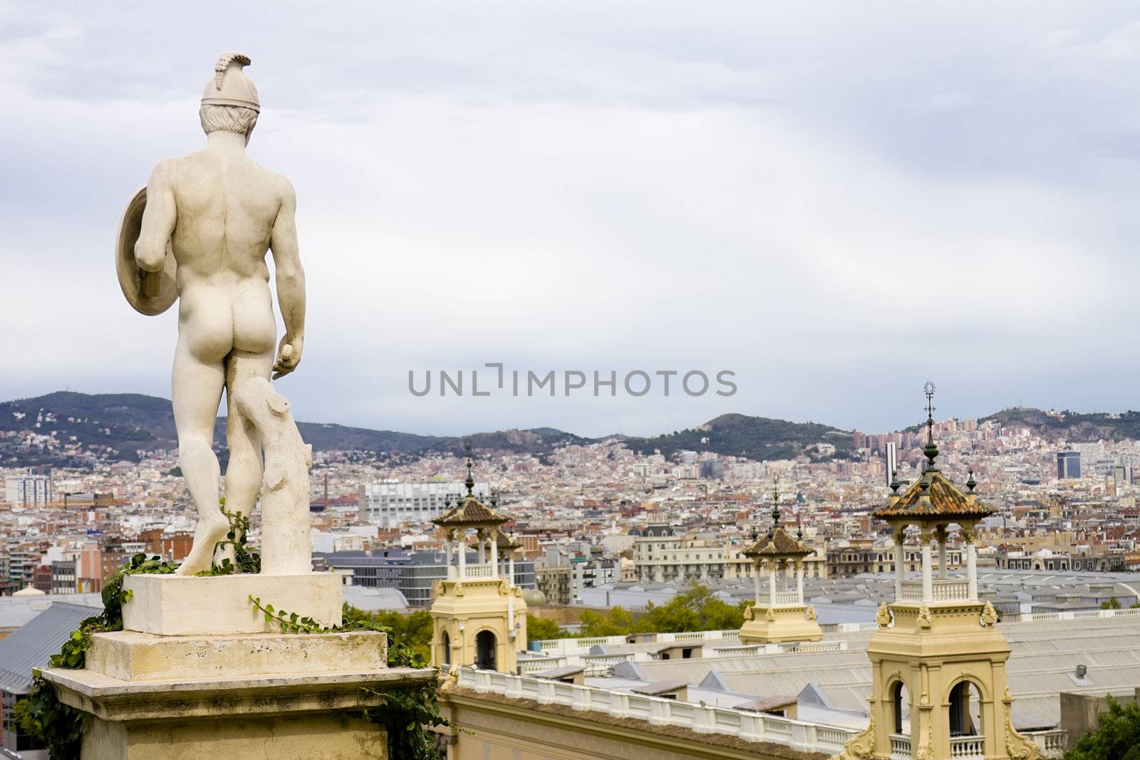 High point of view of Barcelona behind a nude statue