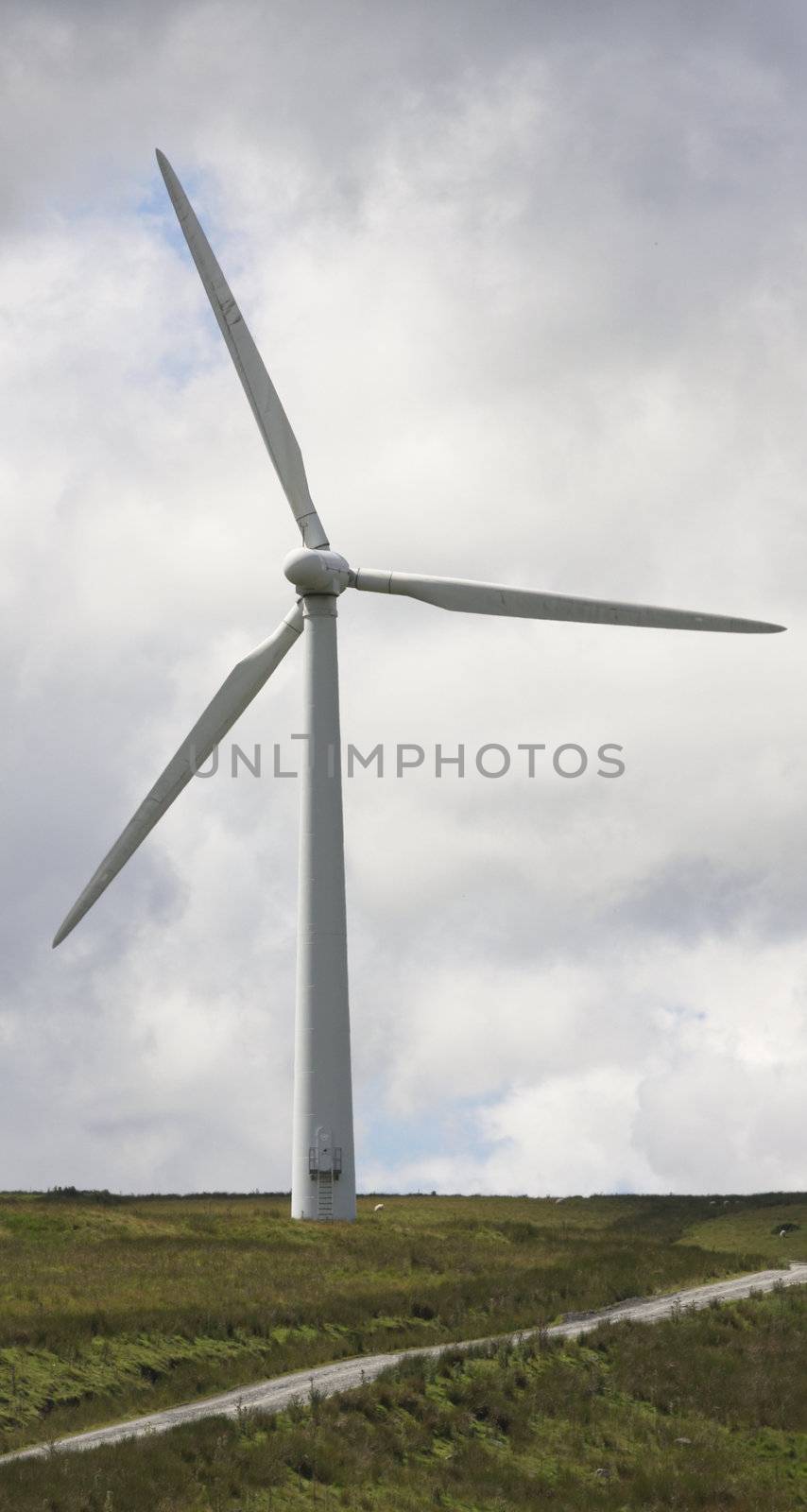 Wind Farm Power Turbines Carno Wales UK against a dark clouds.