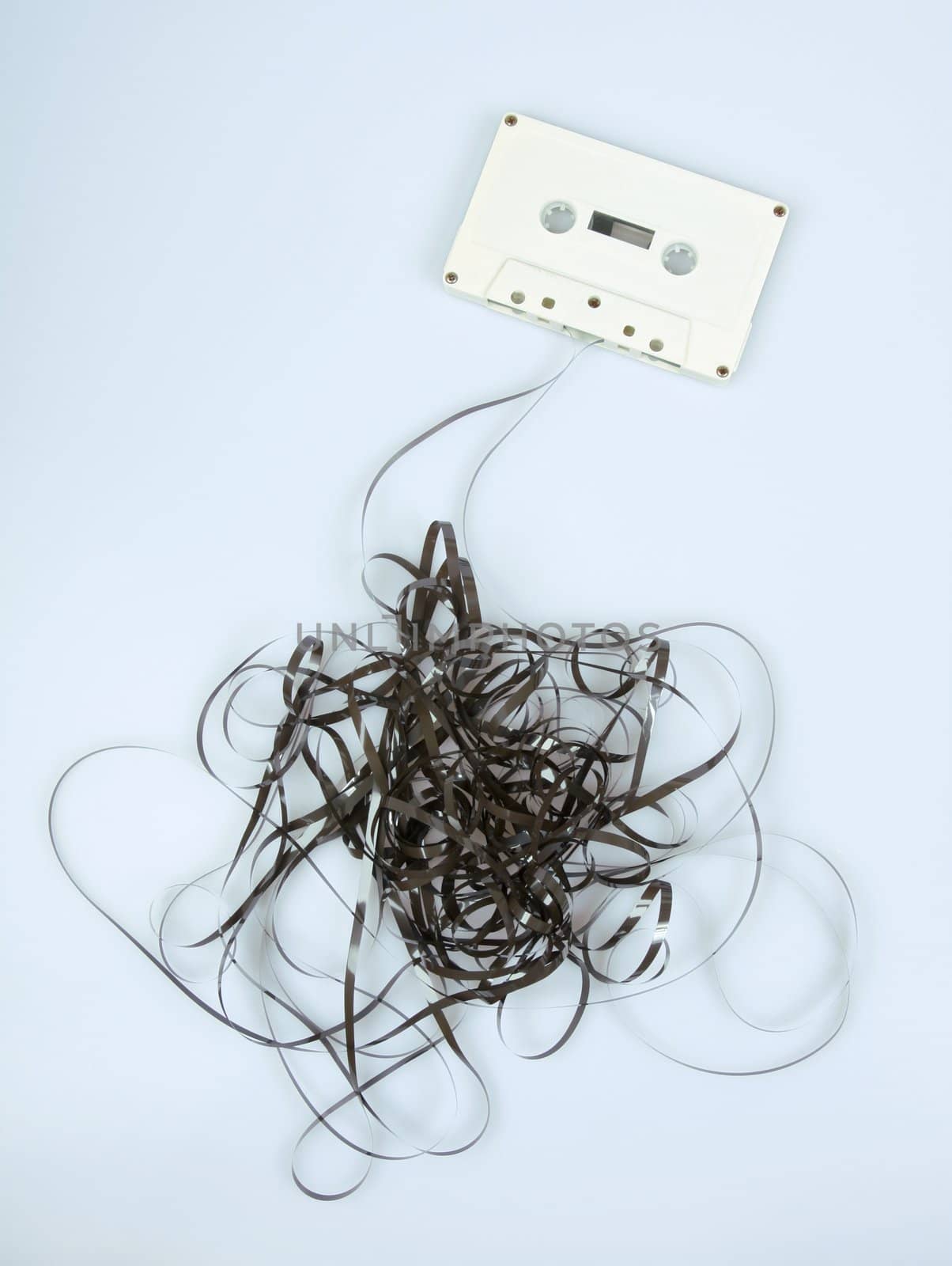 Retro tape all messed up isolated on light background