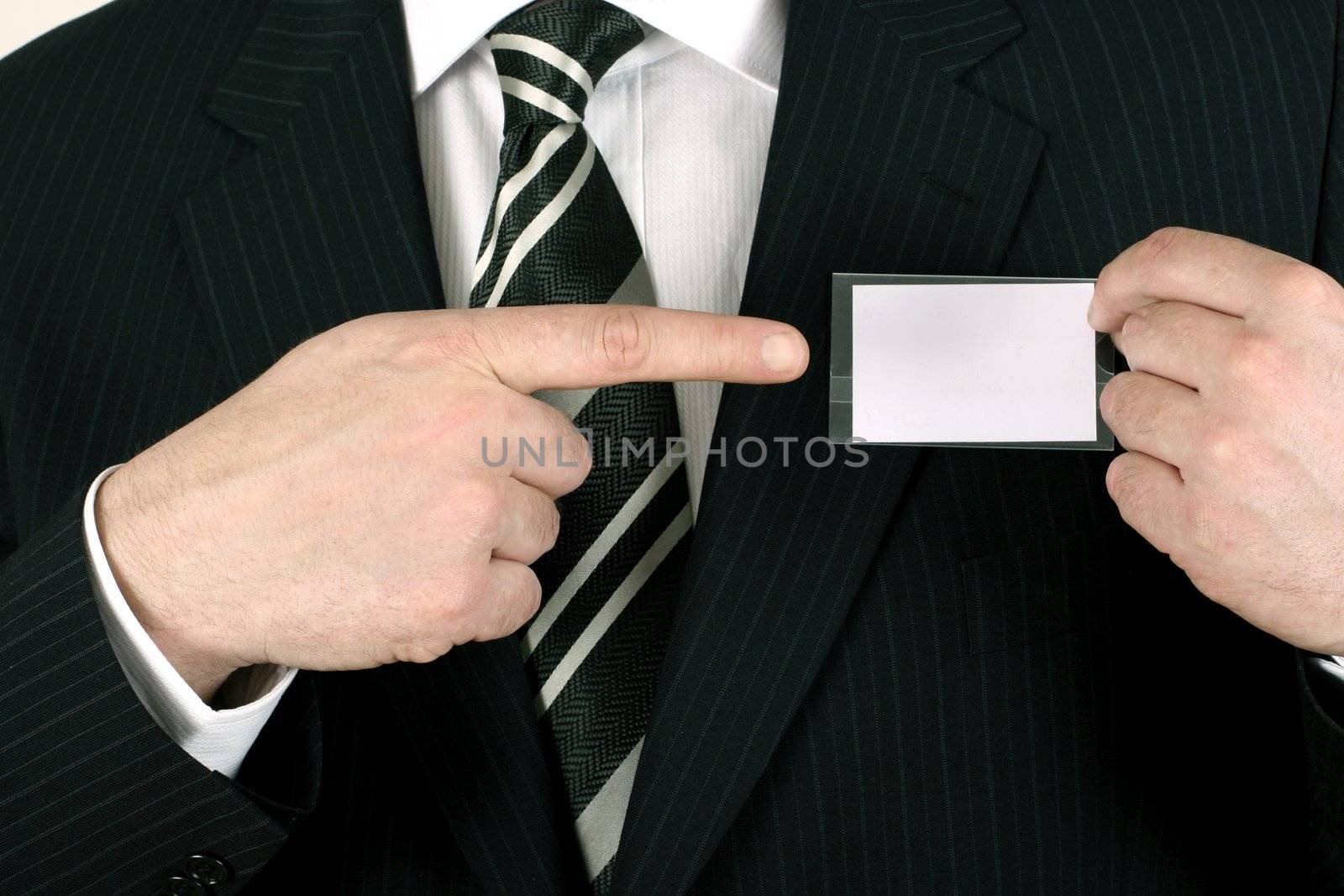 Business man showing his blank namebadge - insert your own brand and information