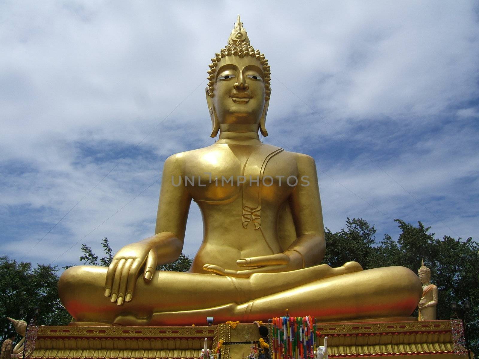 Golden color sitting Buddha in Thailand