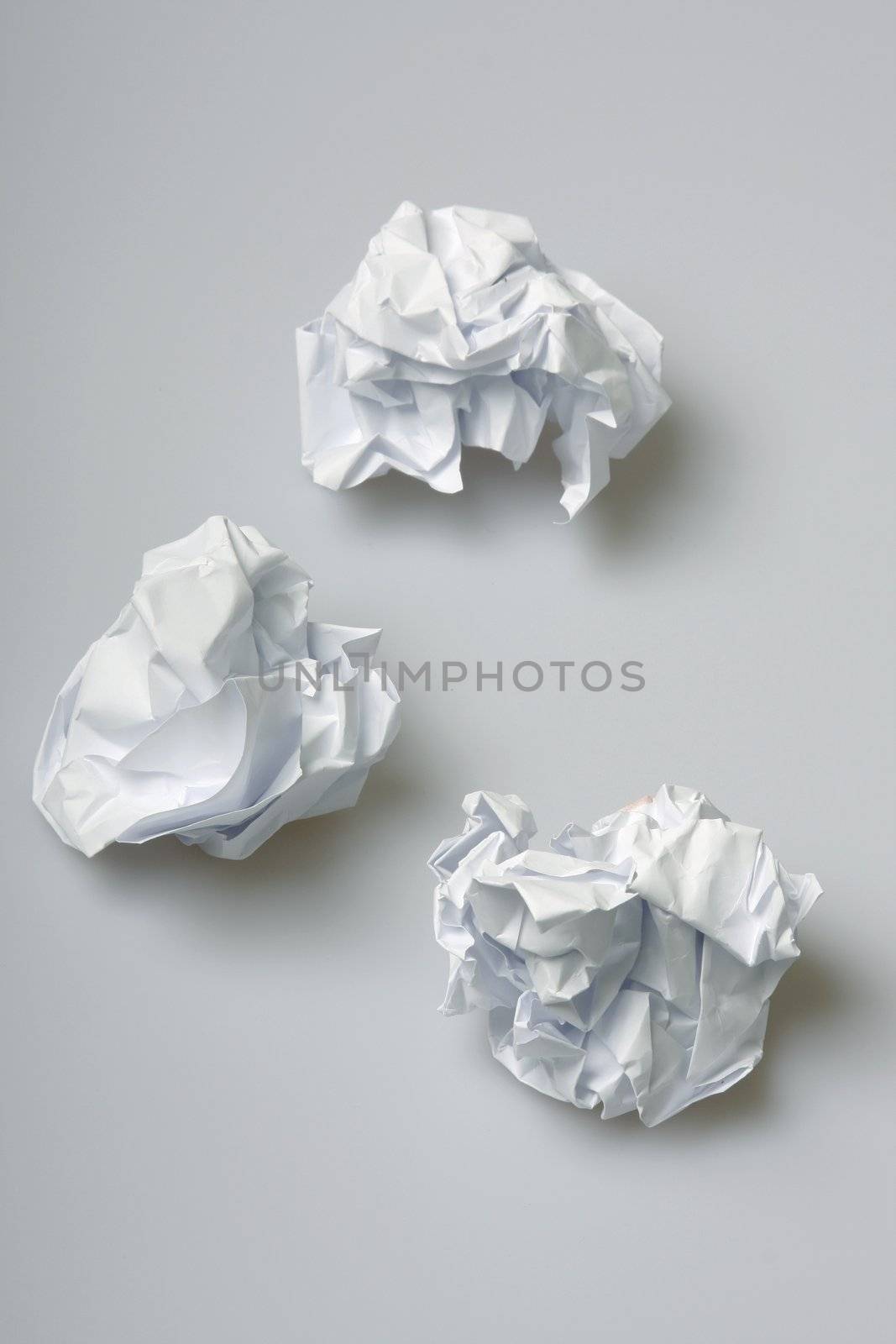 Crumpled paper wads on the floor - concept for creative block