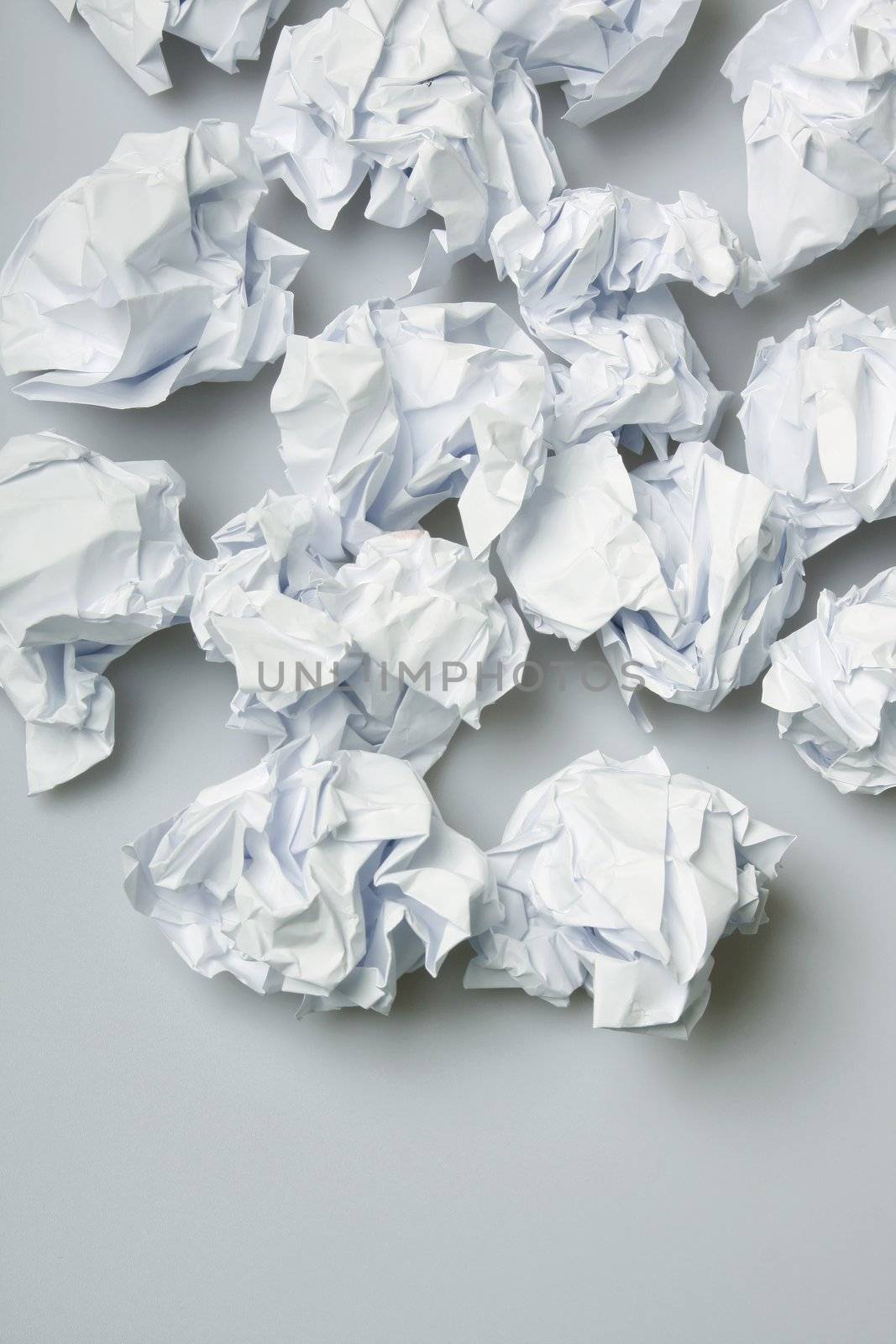 Crumpled paper wads on the floor - copy space below