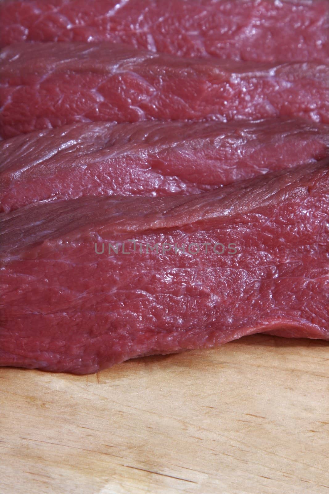 Freshly cut red raw meat close-up