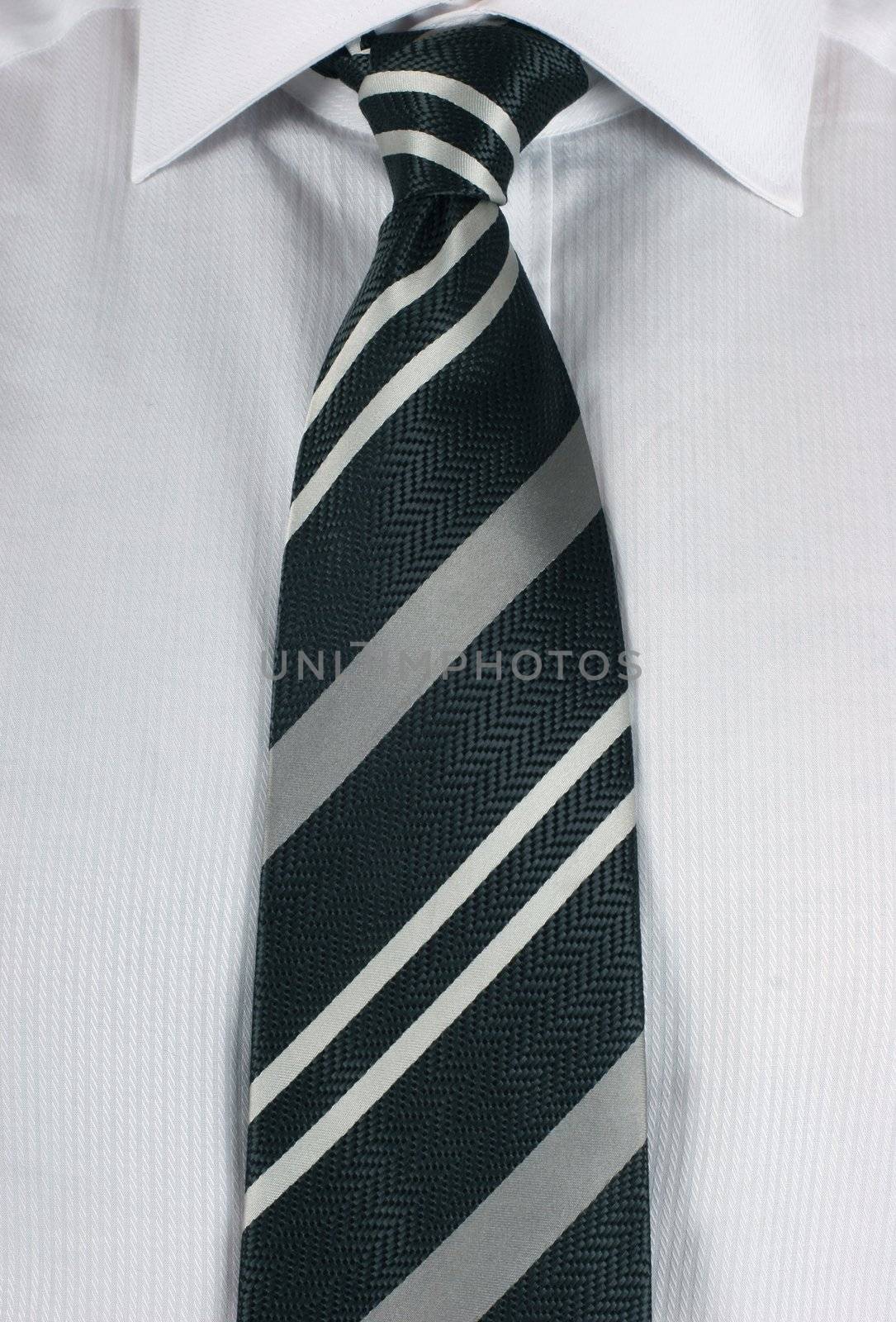 Business man wearing a new white shirt and a tradional neck tie