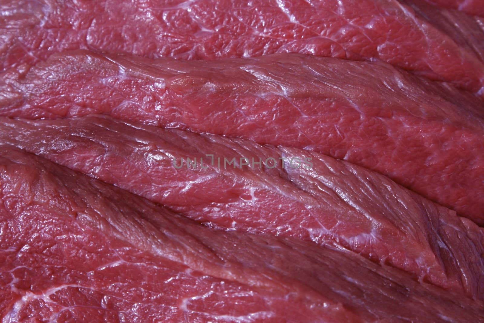 Freshly cut red raw meat close-up
