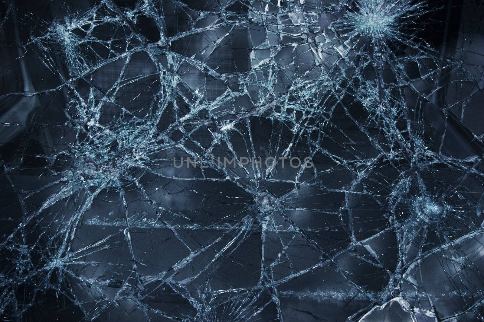 Shattered window surface with cracks all over