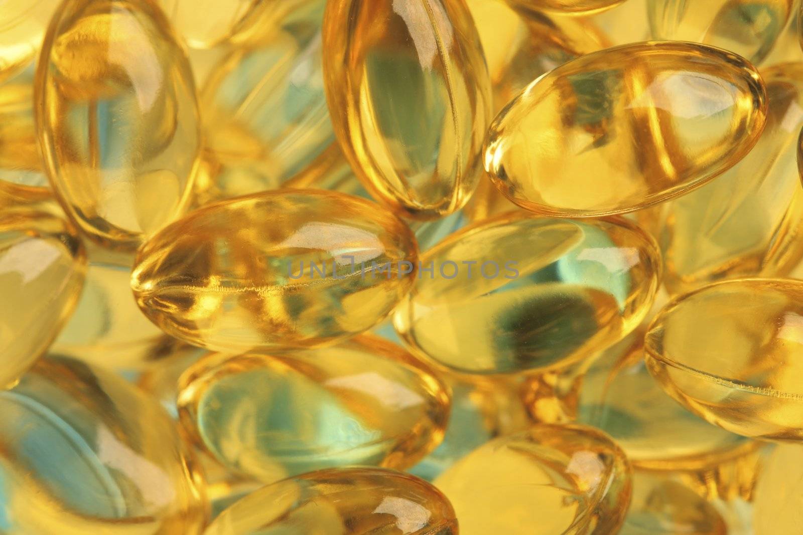 Healthy fish oil nutritional supplements pills / close-up macro