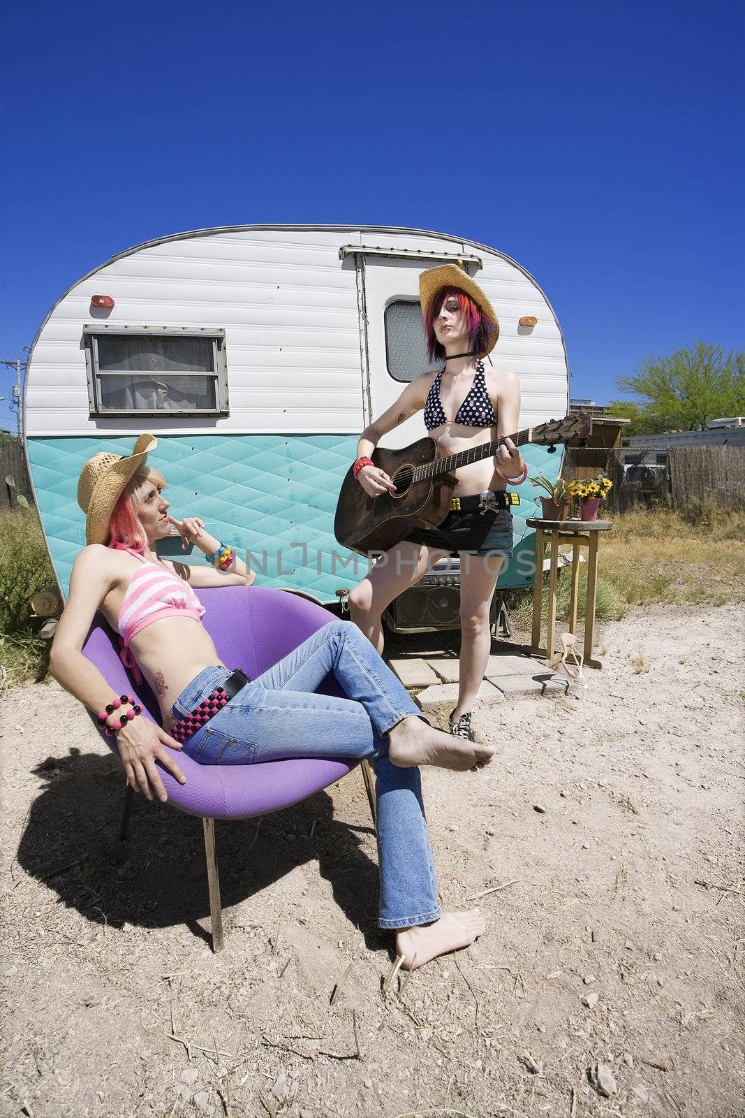 Young Women in Front of a Trailer by Creatista