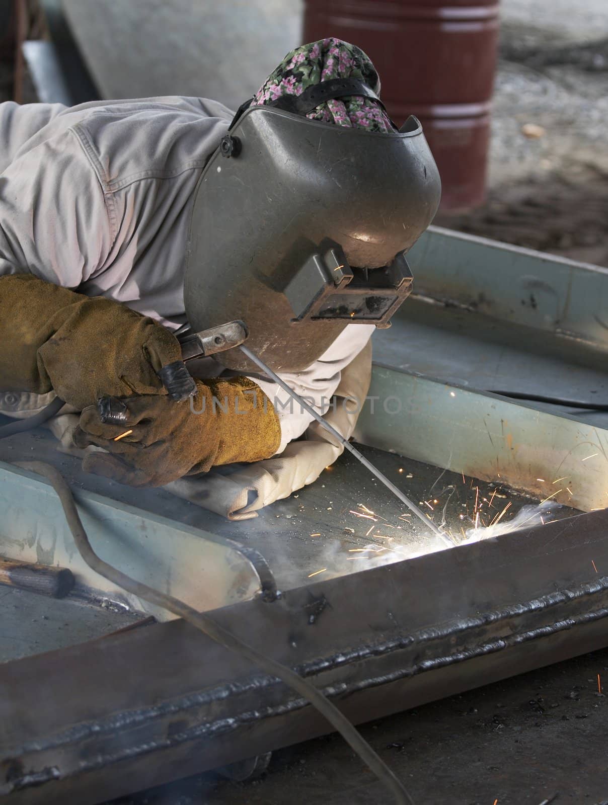 a welder working at shipyard during day shift