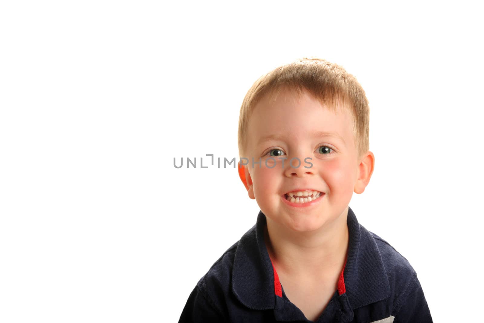 Young smiling boy with green eyes and blonde hair