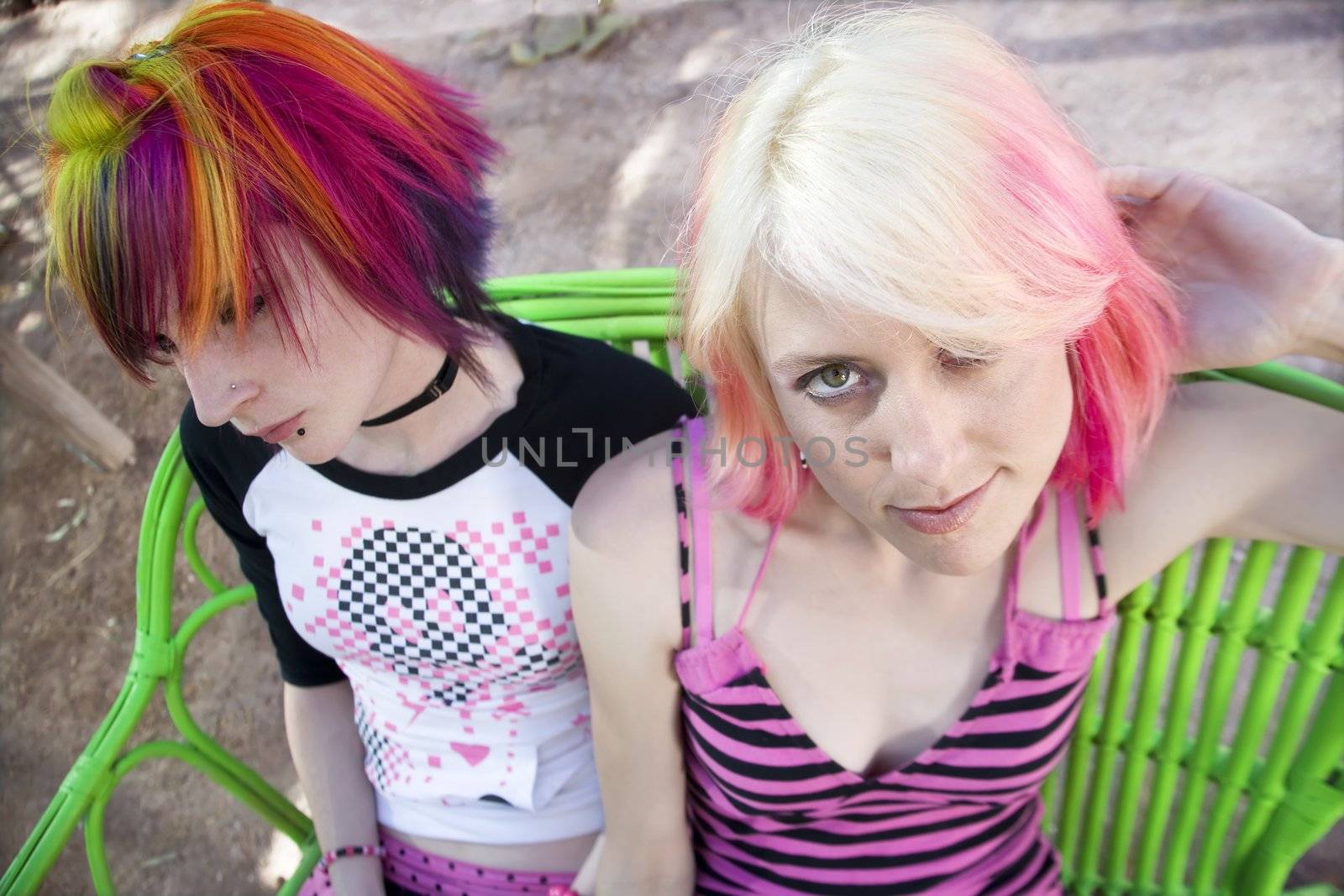 Two Pretty Punk Girls on a Green Bench