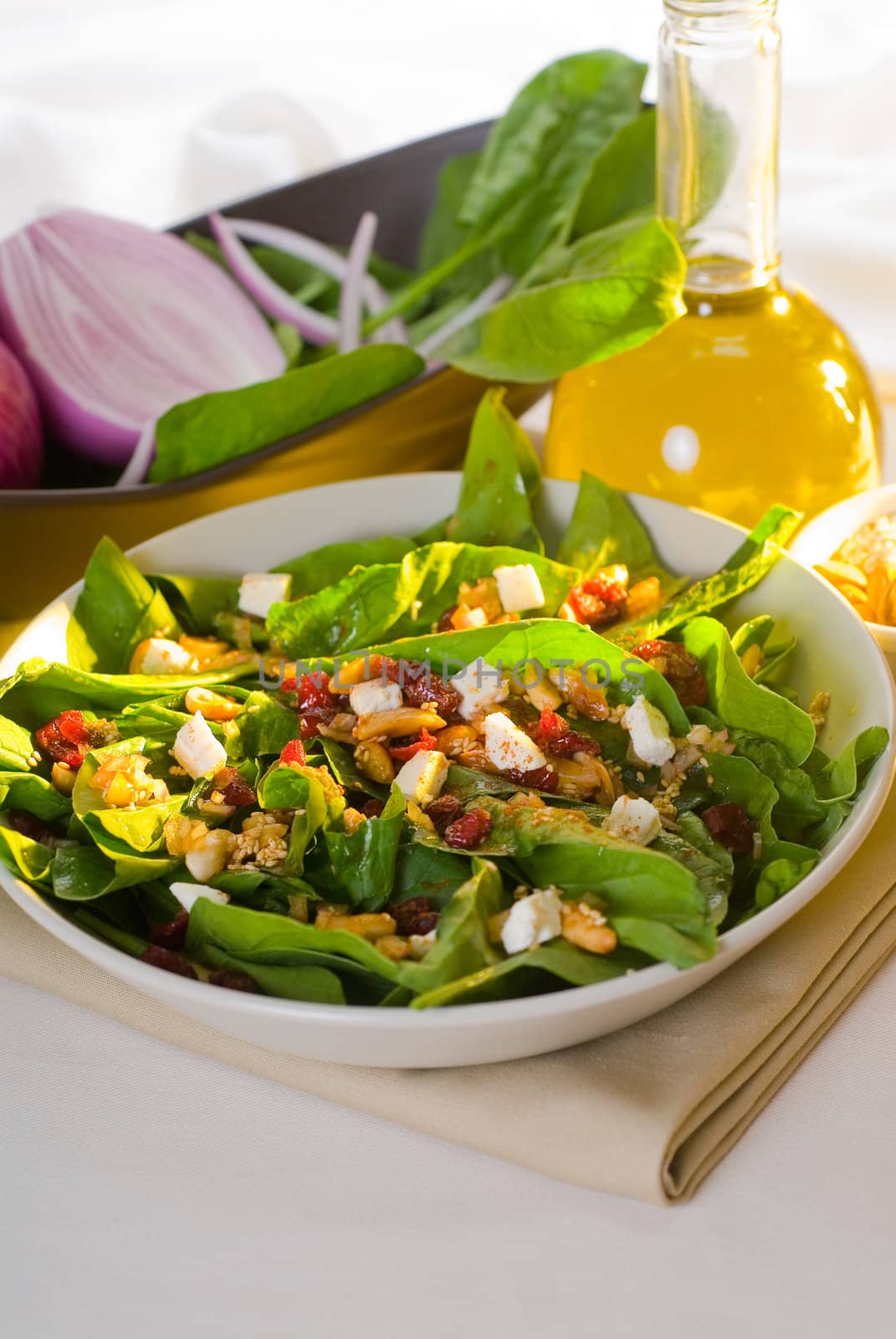 plate of fresh colorfull spinach salad close up