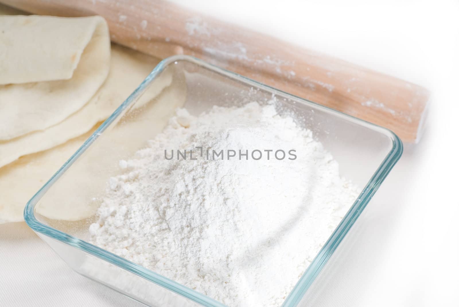 making fresh homemade pita bread ,with ingredients overa table