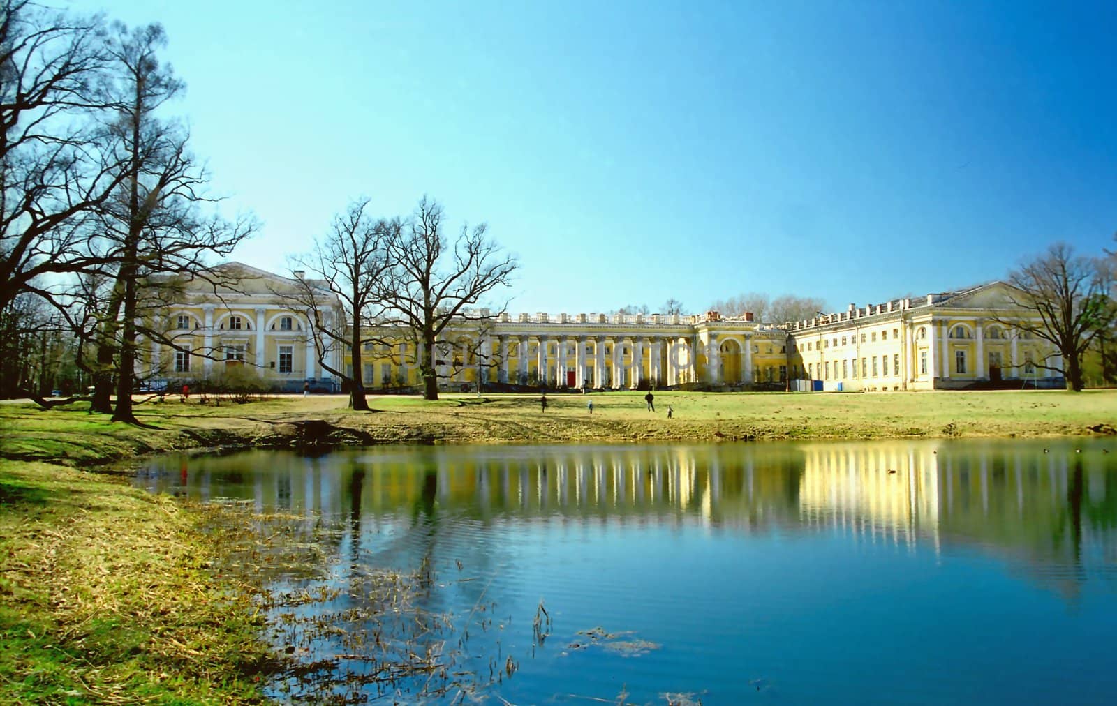 Old palace near the pond in the beginning of Spring