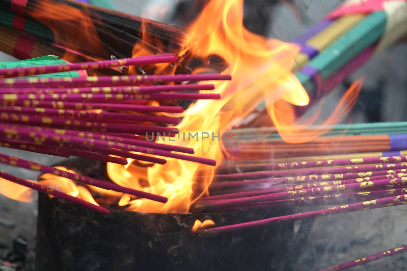 People burning incence in Chinese temple