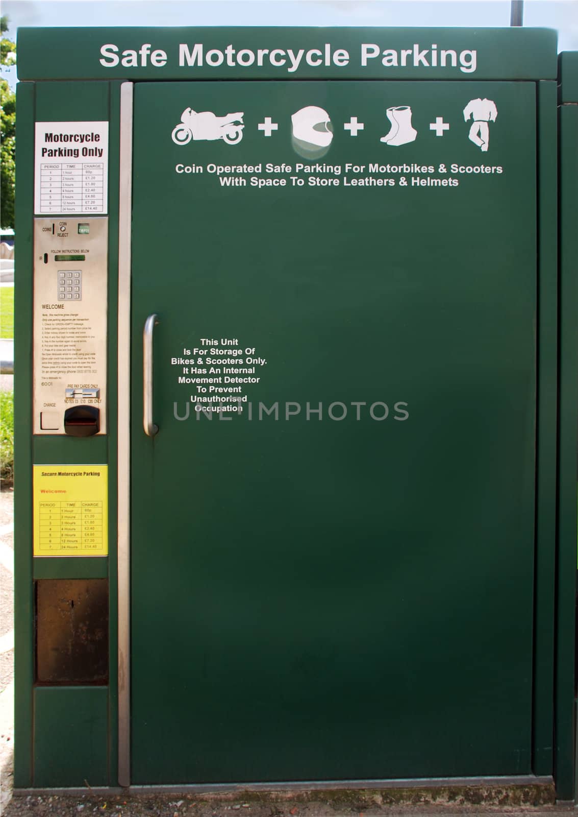 A photograph of a booth to keep motorcycles and scooters safely parked