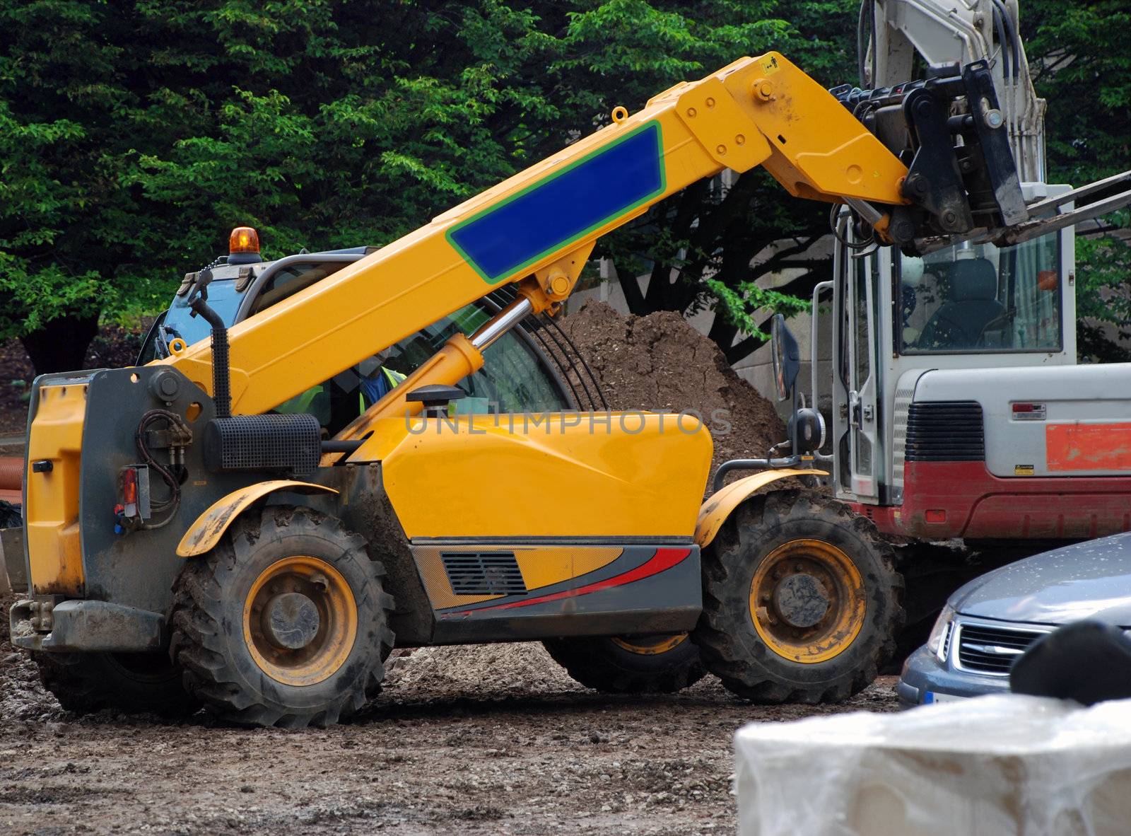 A photograph of a fork-lift truck active on an English building site