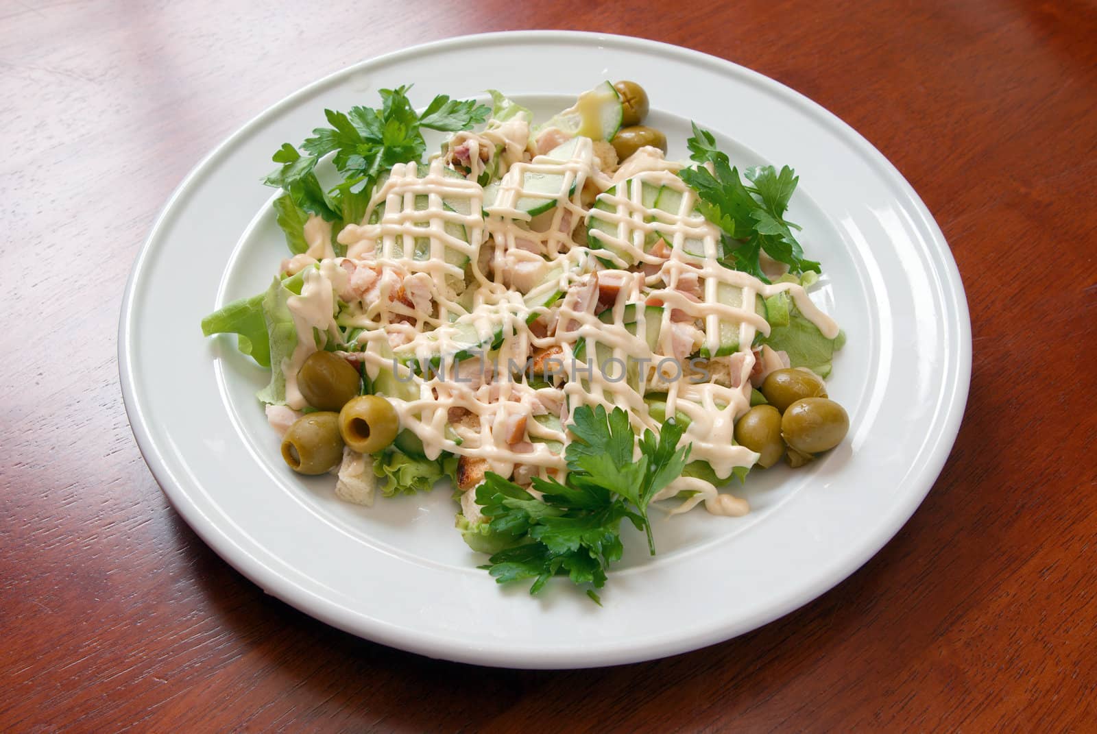 The Italian salad with olives and a liver.Italian kitchen