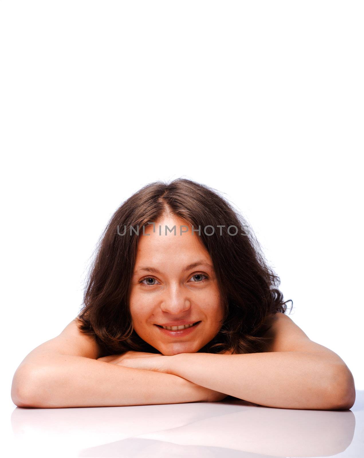 A young, attractive and happy woman is smiling