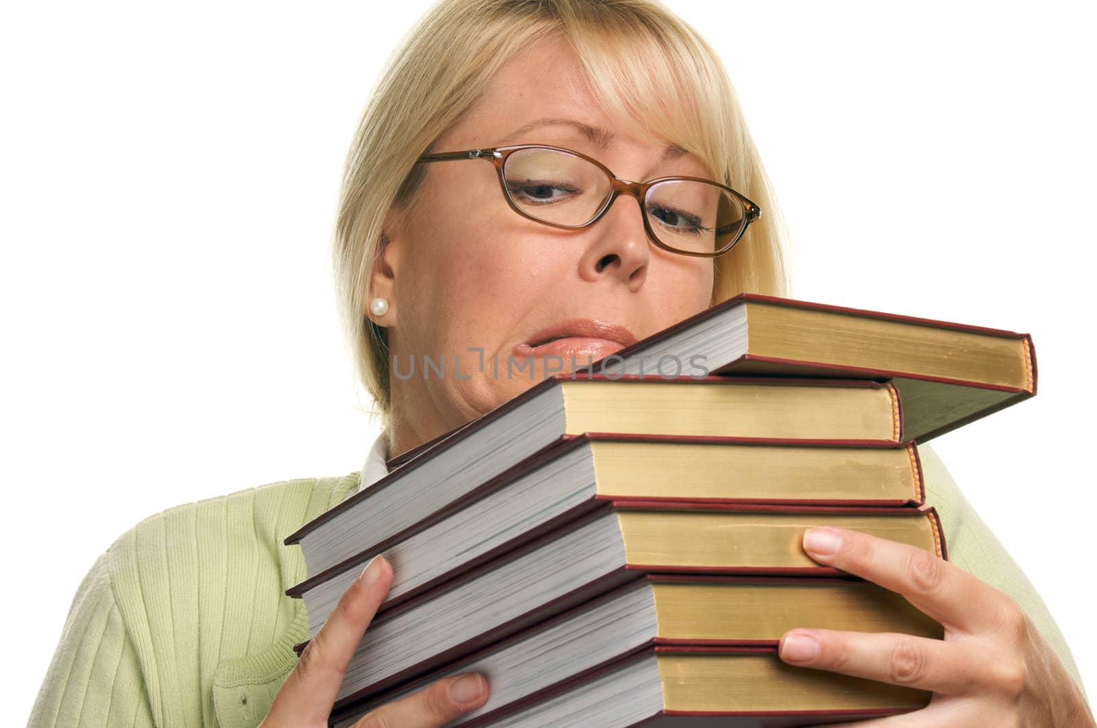 Attractive Student Struggles with Her Books Isolated on a White Background.
