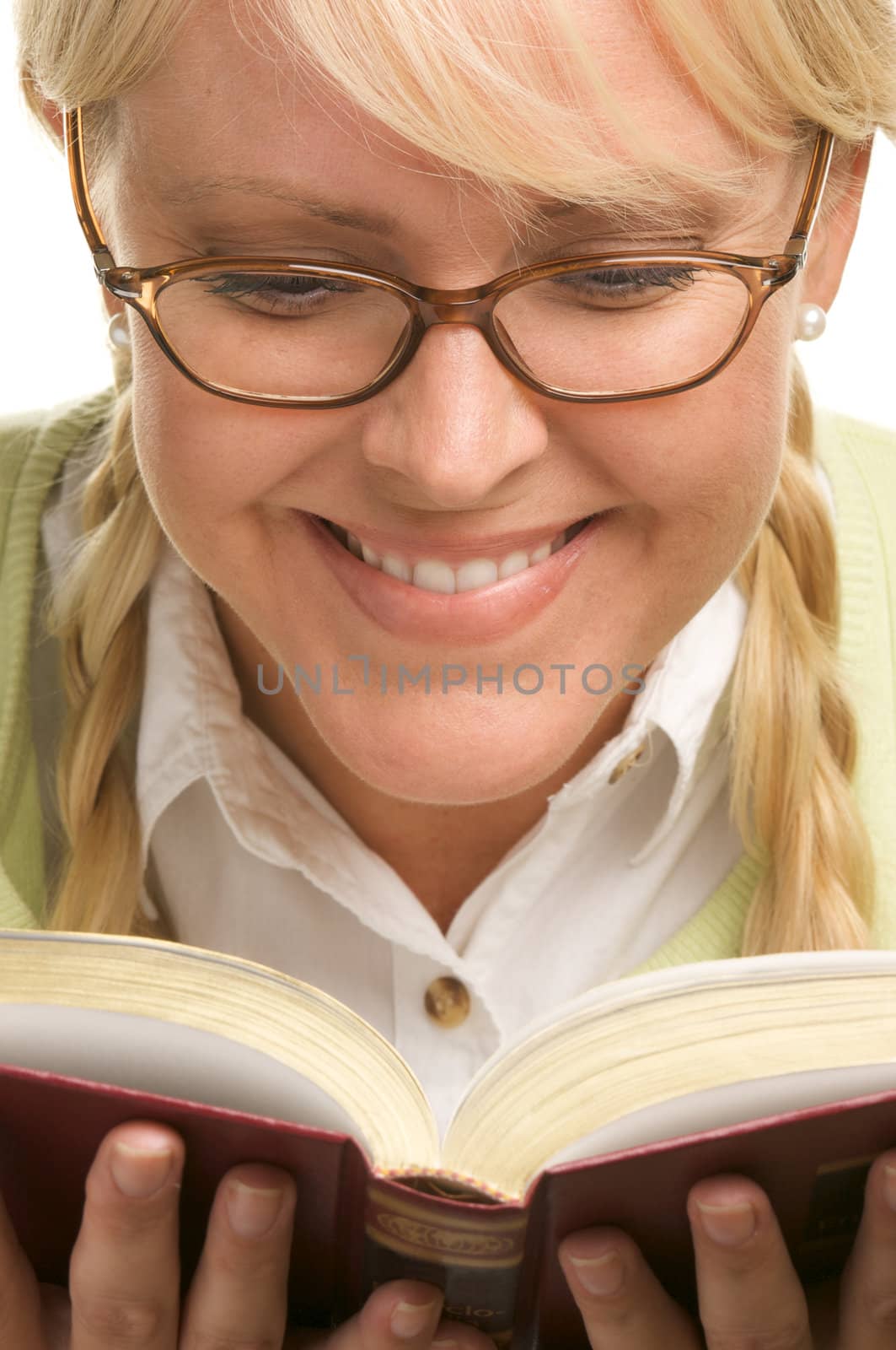 Female With Ponytails Reads Her Book isolated on a White Background.