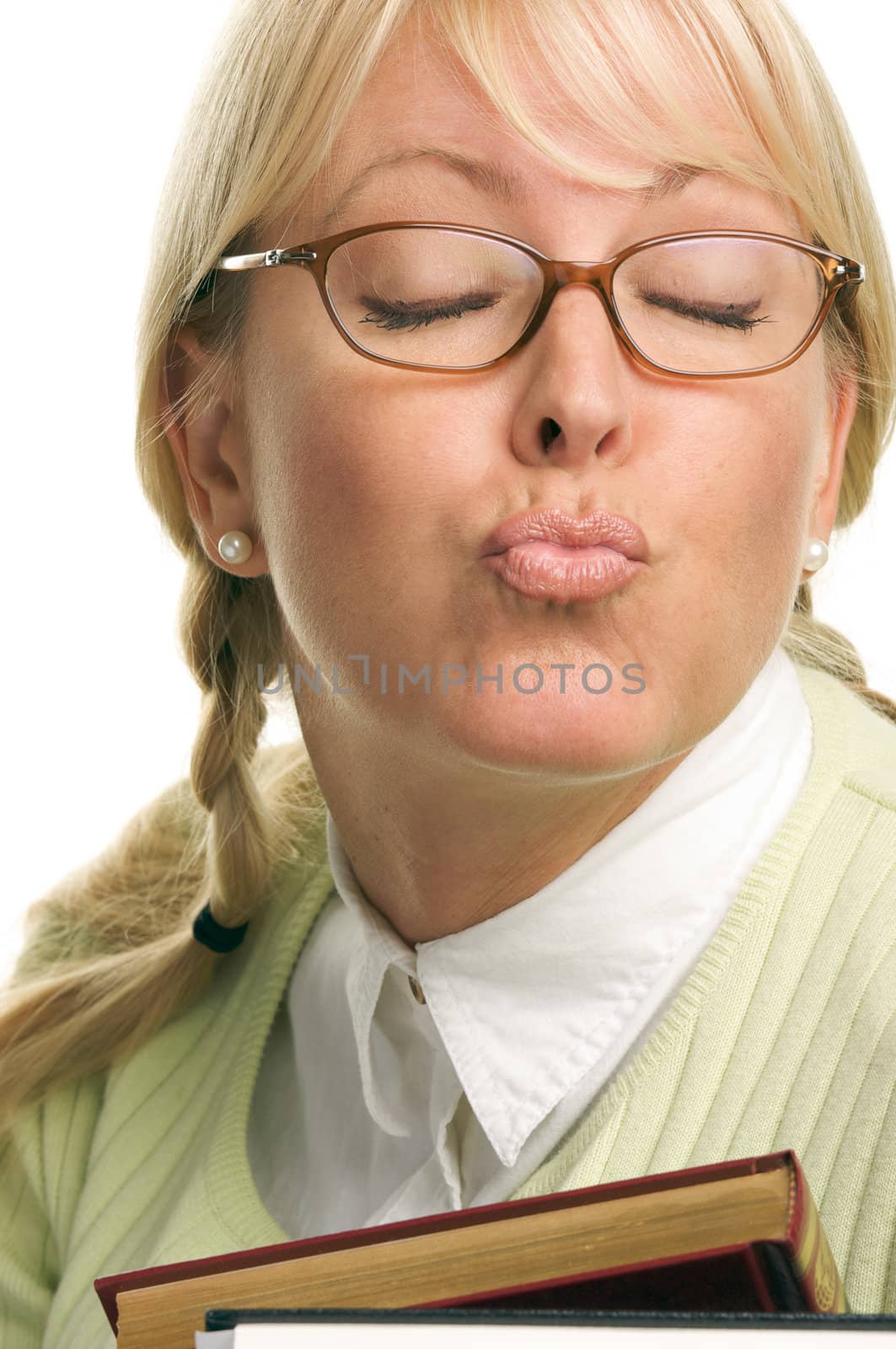 Flirtatious Attractive Student Carrying Her Books Isolated on a White Background.