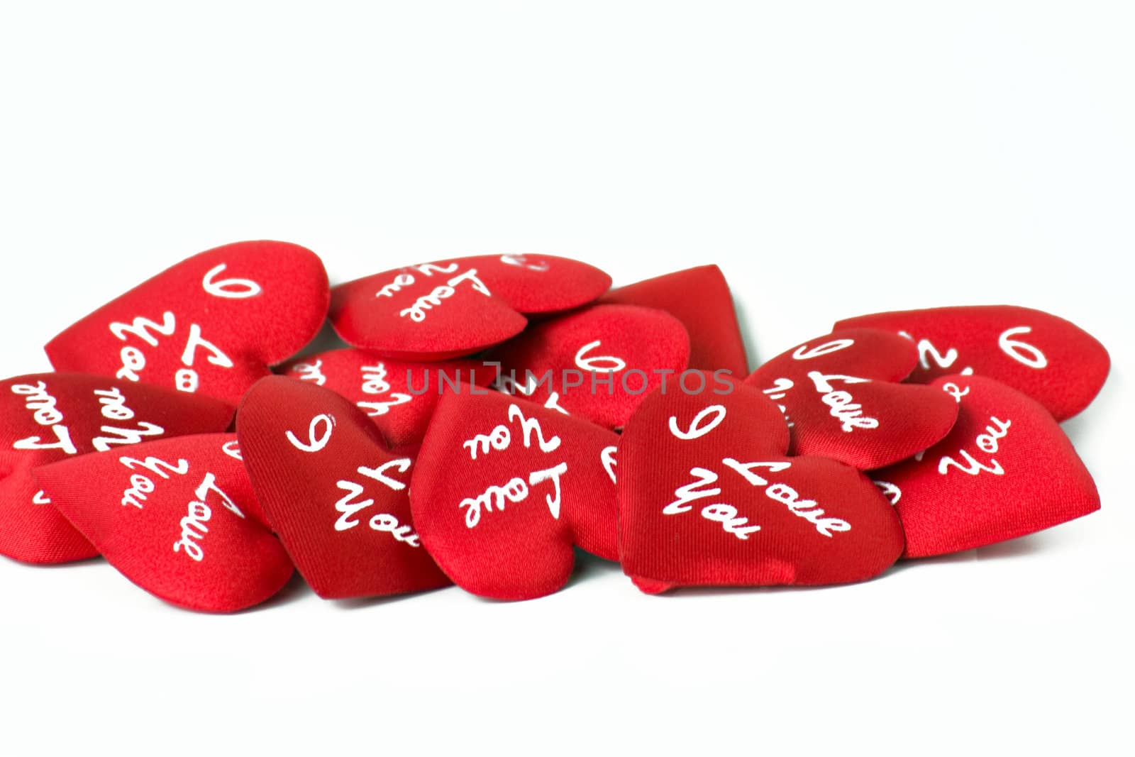 A lot of red hearts with words on a white background.