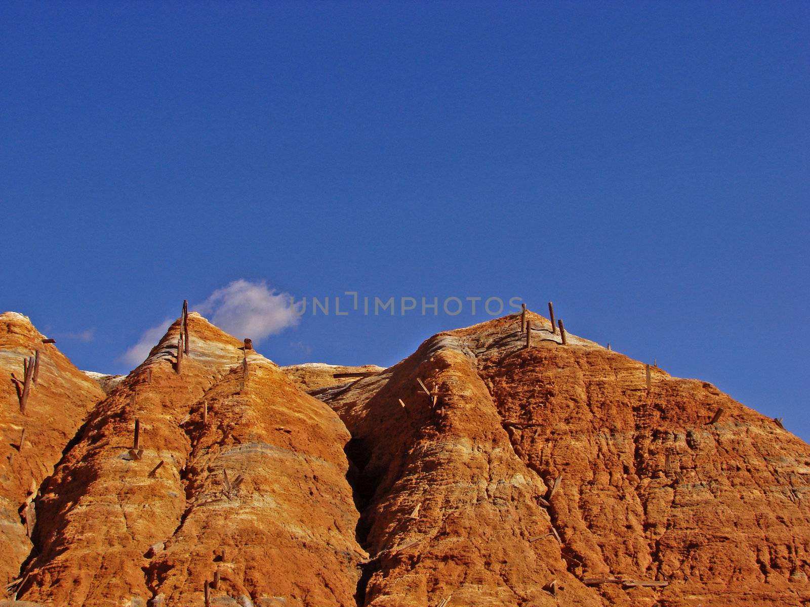 Deserted copper mine on a blue sky background