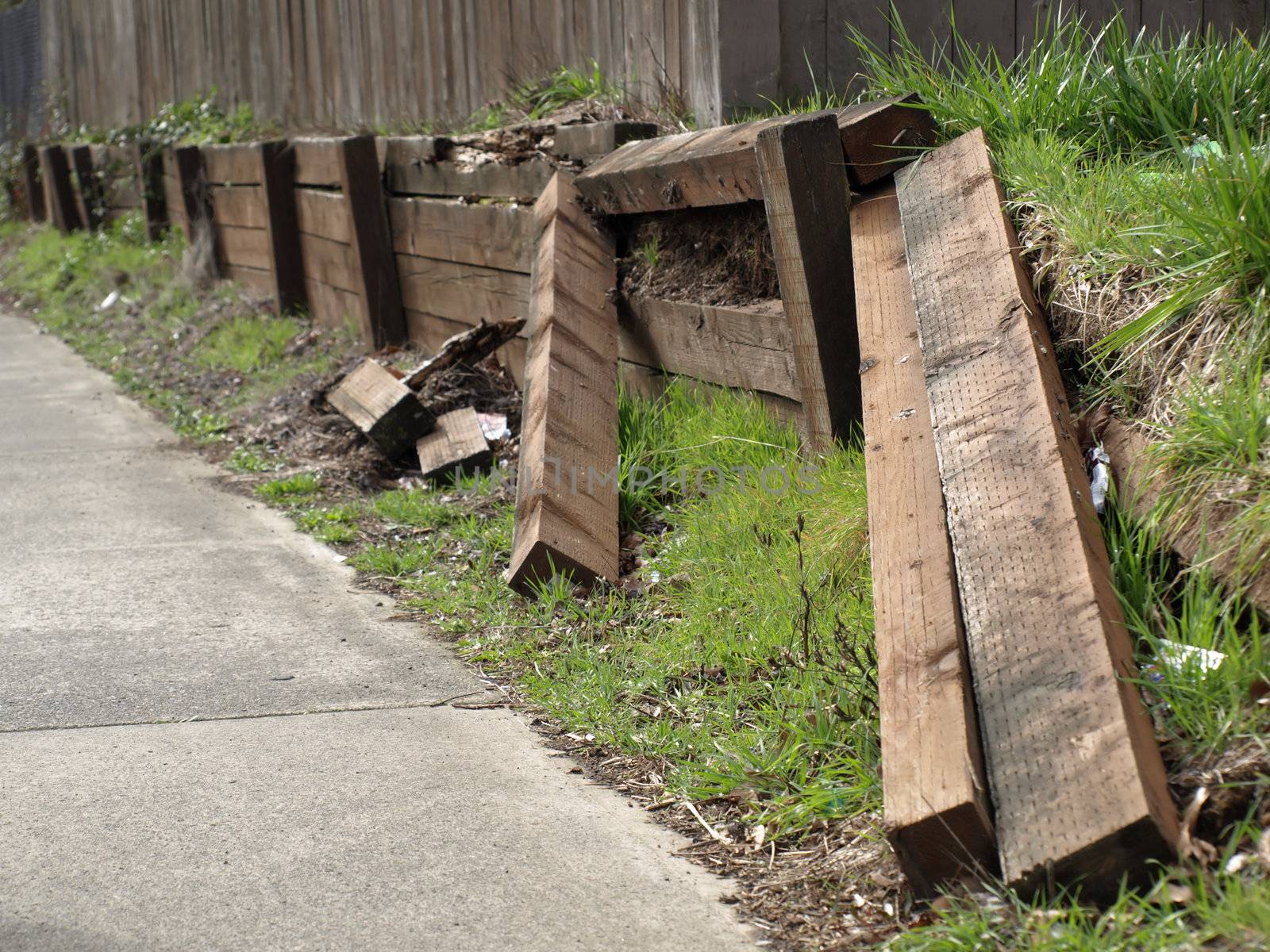 A retaining wall in a vandalized state in need of repair.