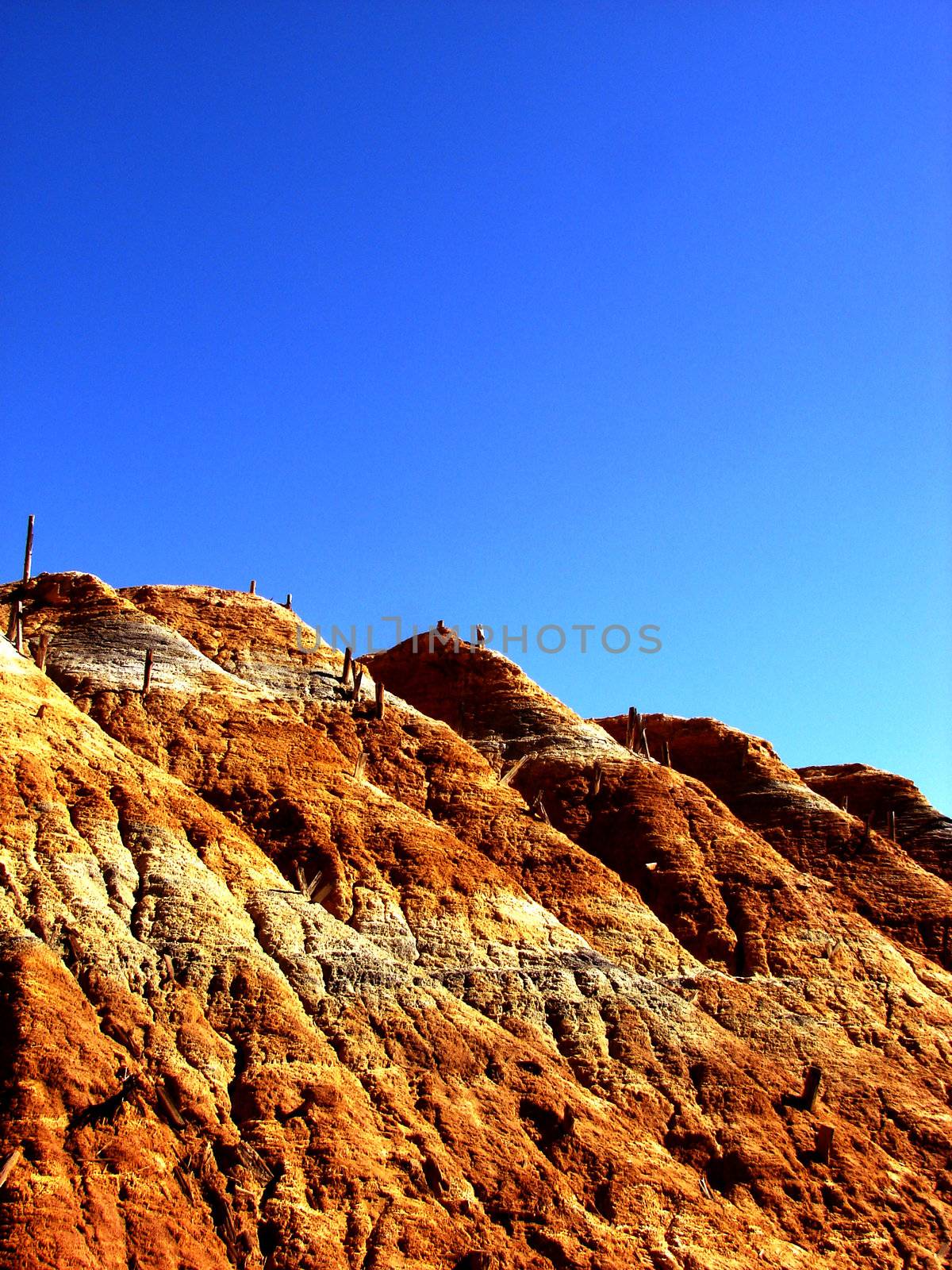 Deserted copper mine on a blue sky background