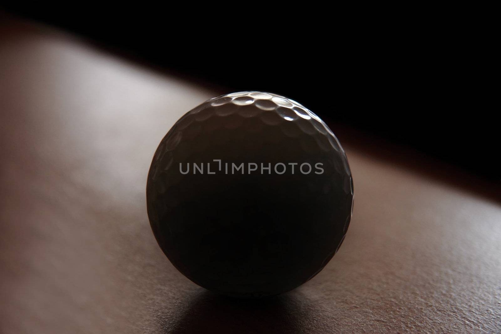 a golf ball showing dark and light