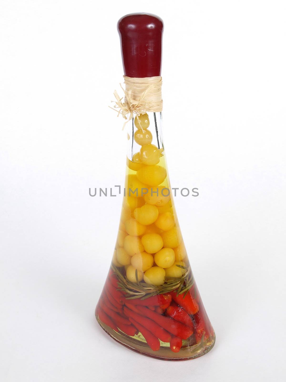 A colorful vinegar bottle isolated on a white background.