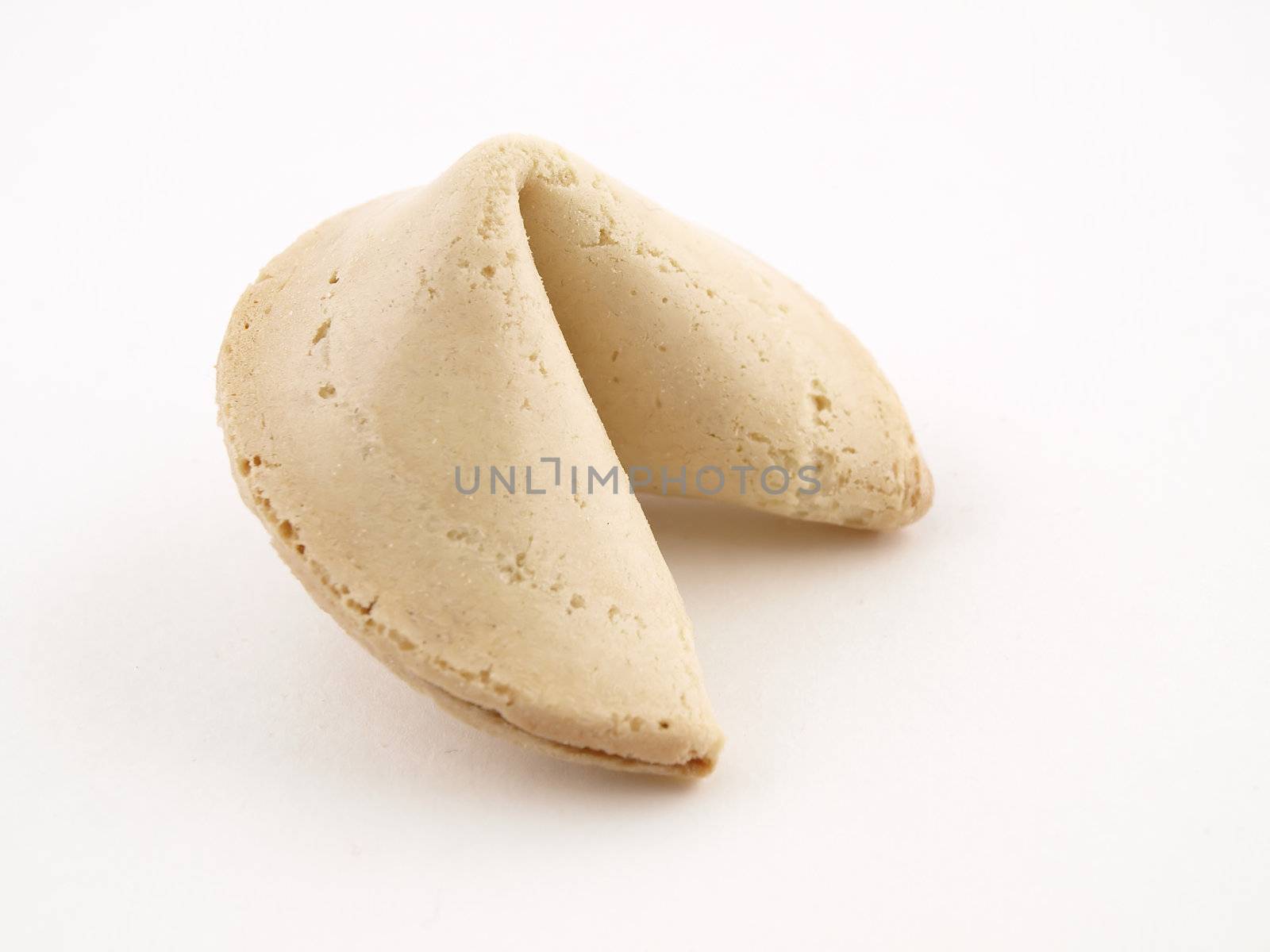 A Single Fortune cookie isolated on a white background