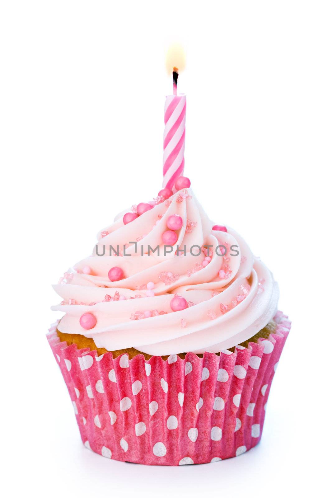 Pink birthday cupcake isolated on white