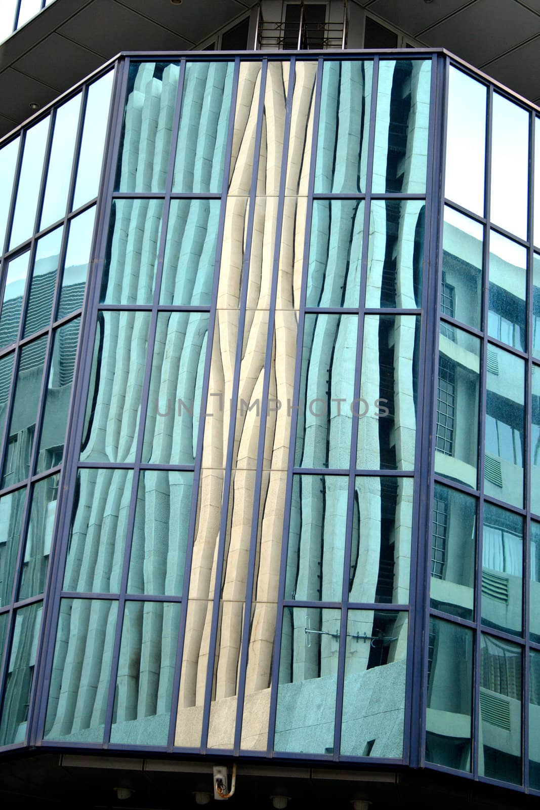 Reflection in the large glass panels of a modern building