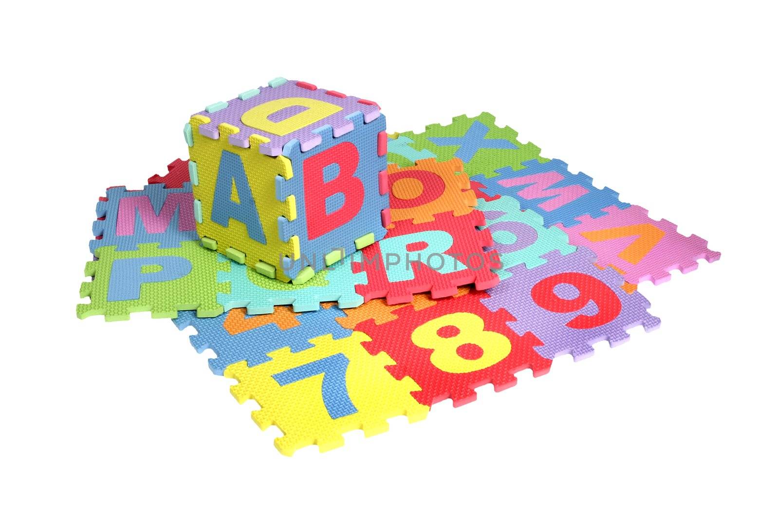 Bright colourful puzzle mats with matching spaces for letters and figures on white background. Clipping path included.