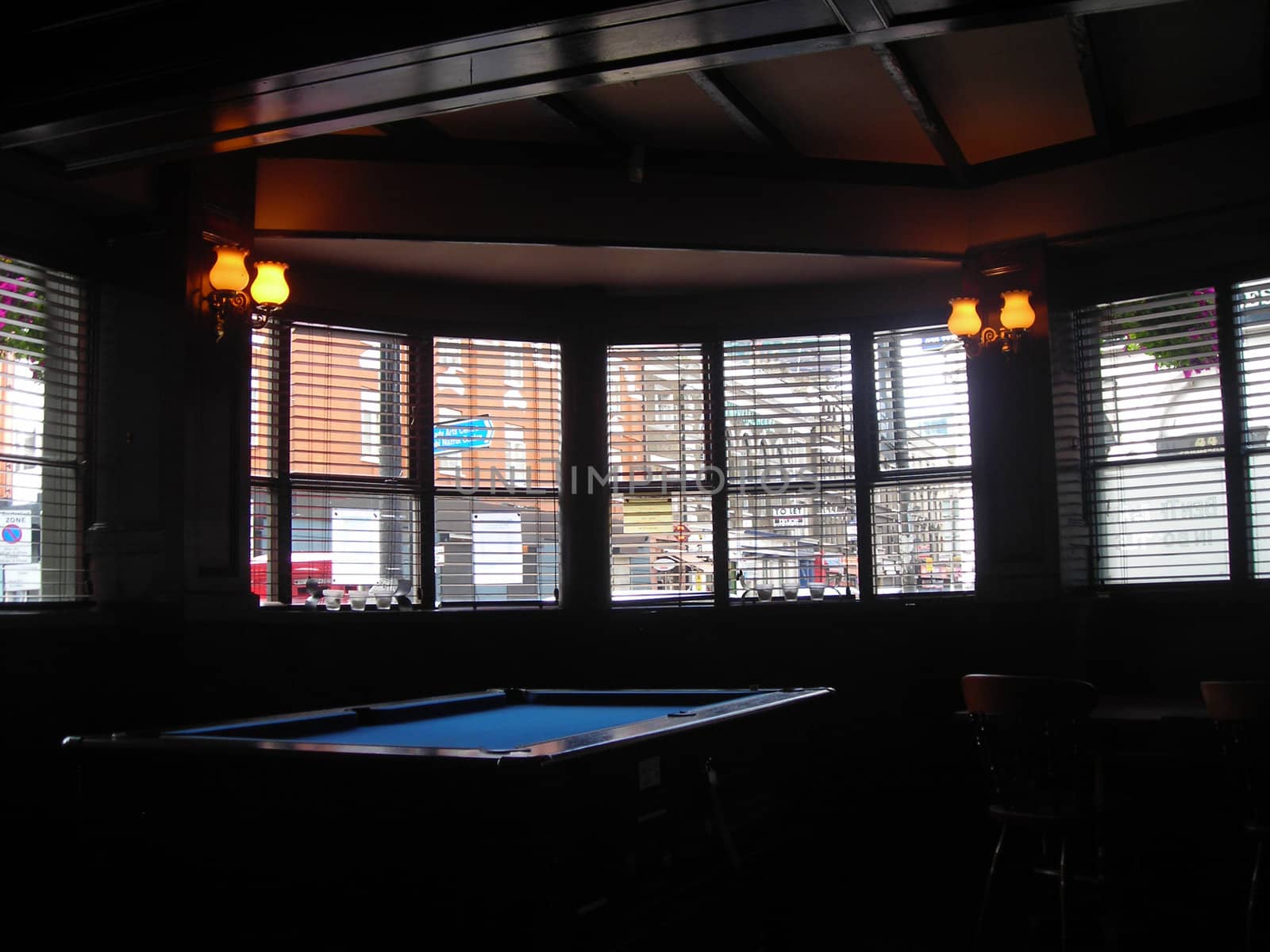 A pool table inside a tavern in London.