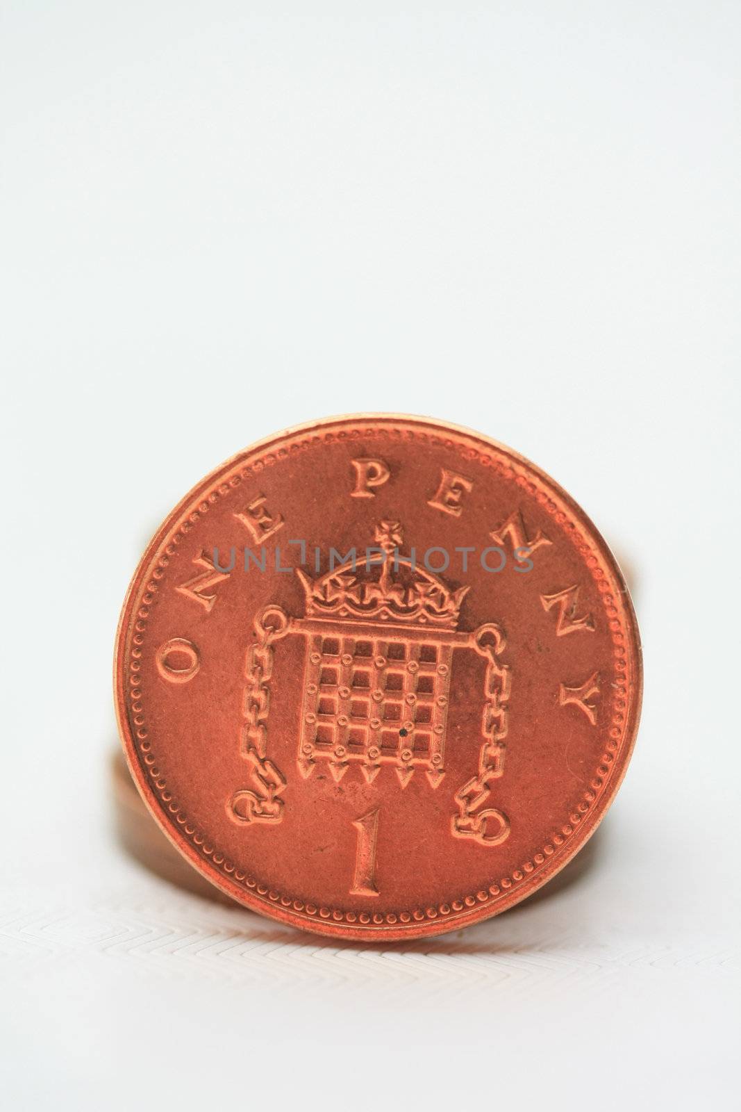 One penny, an English brass coin, isolated in close up