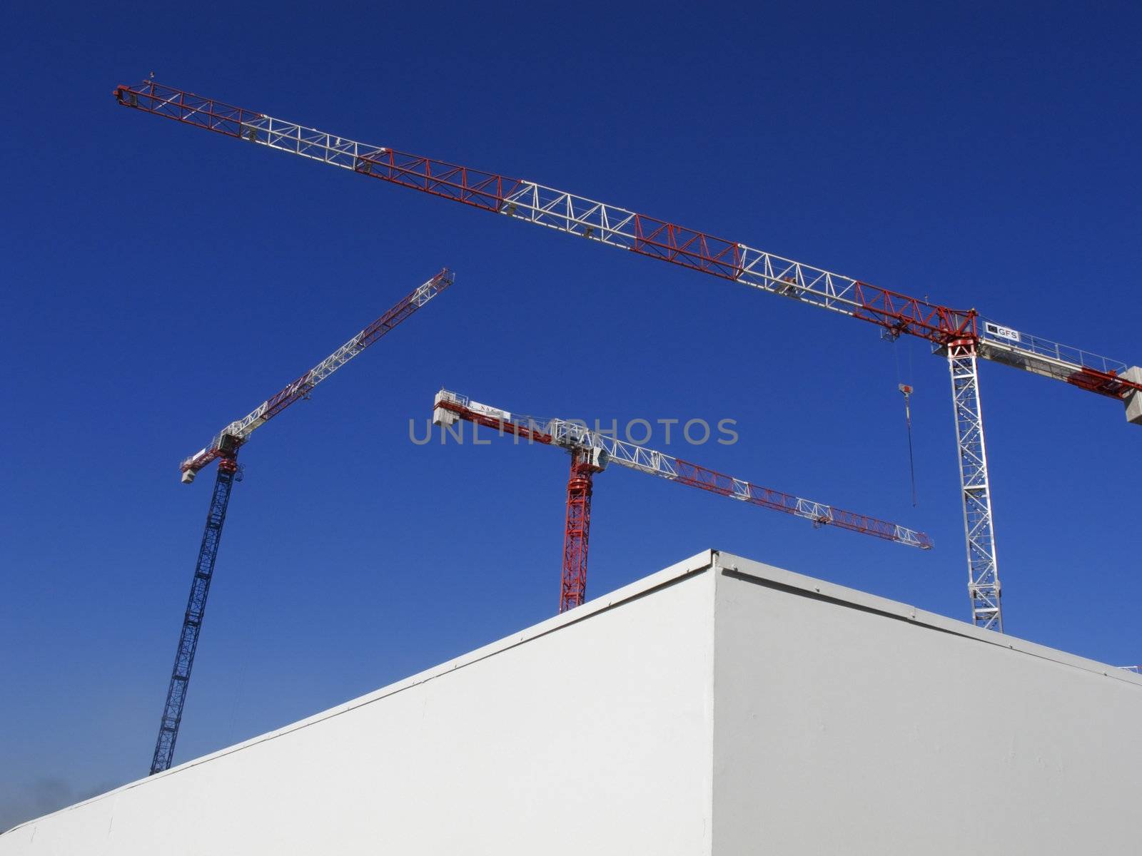 Construction cranes in the Port Vell, Barcelona, Catalonia, Spain