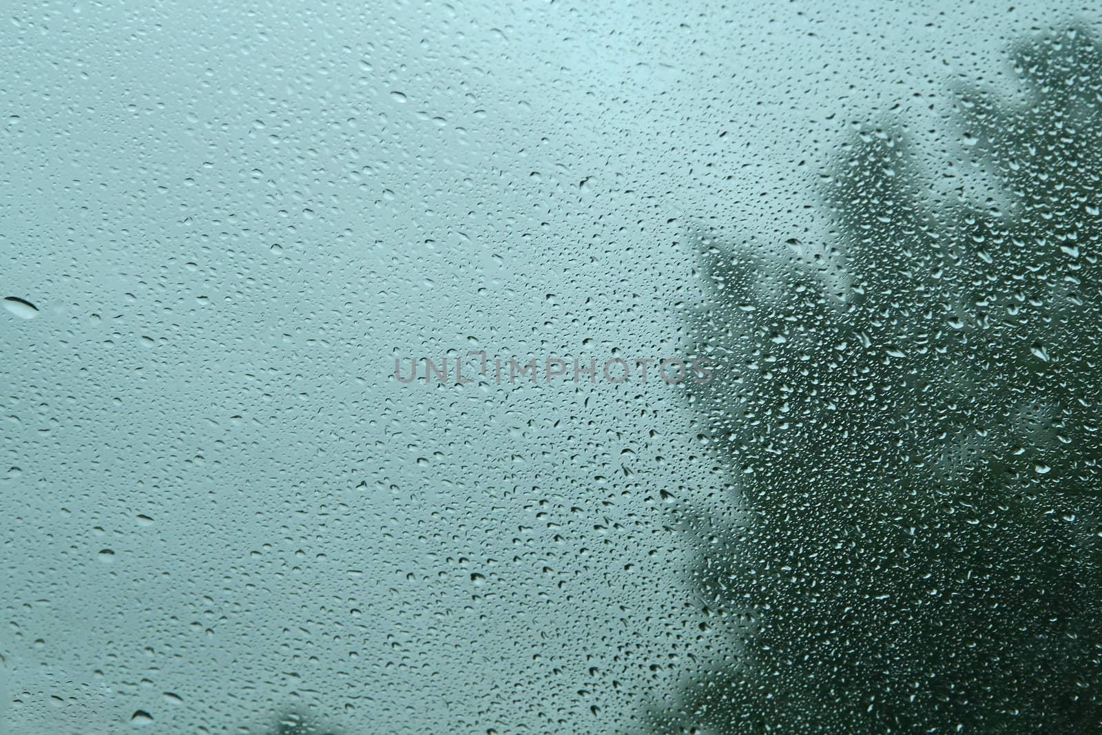 Water raindrops on a window after storm.