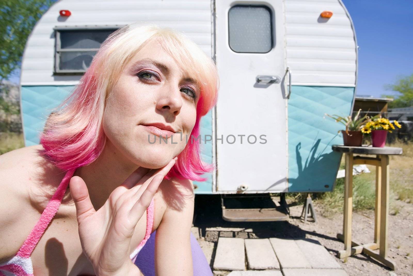 Pretty Woman Front of a Vintage Travel Trailer