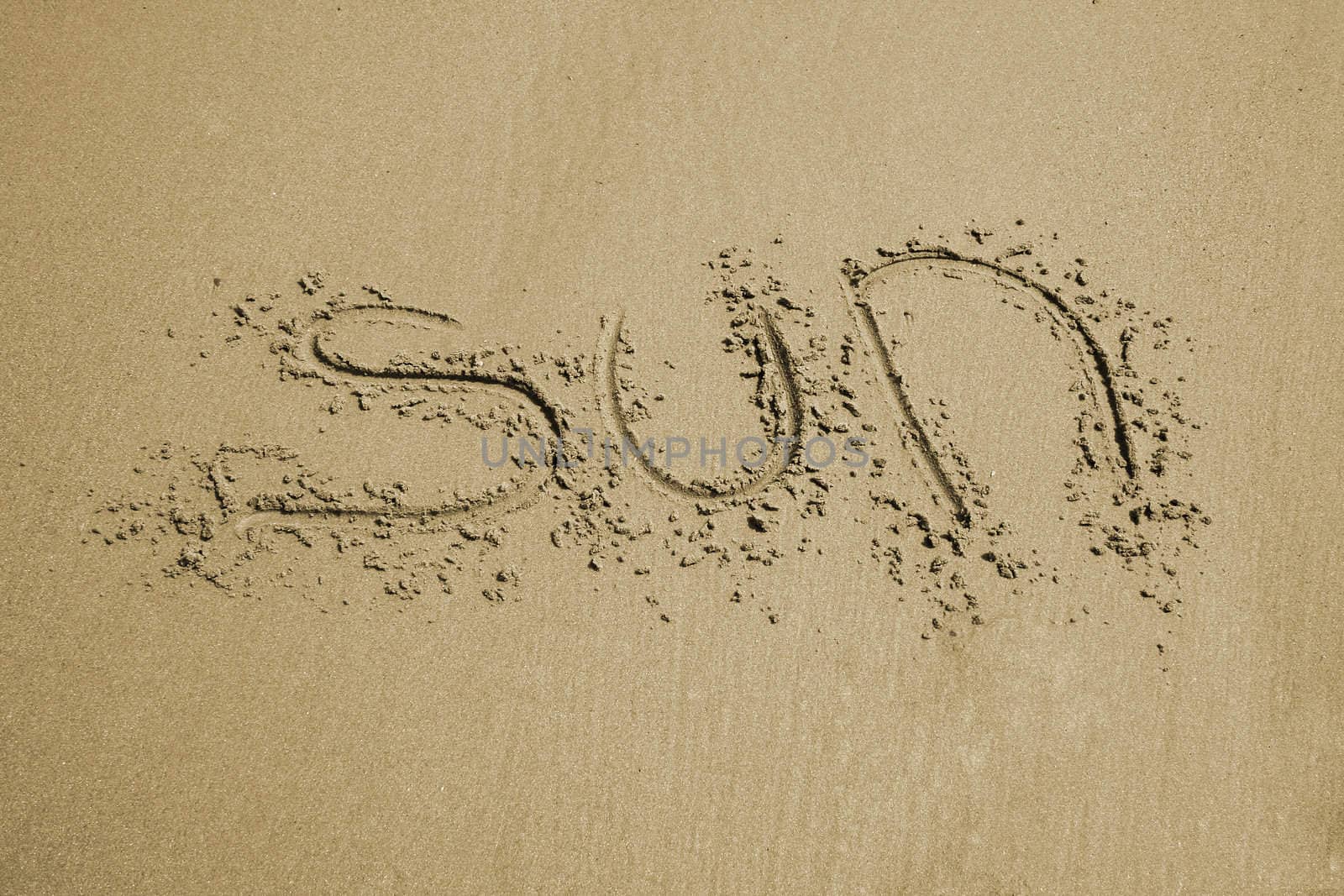 the word sun written in sand