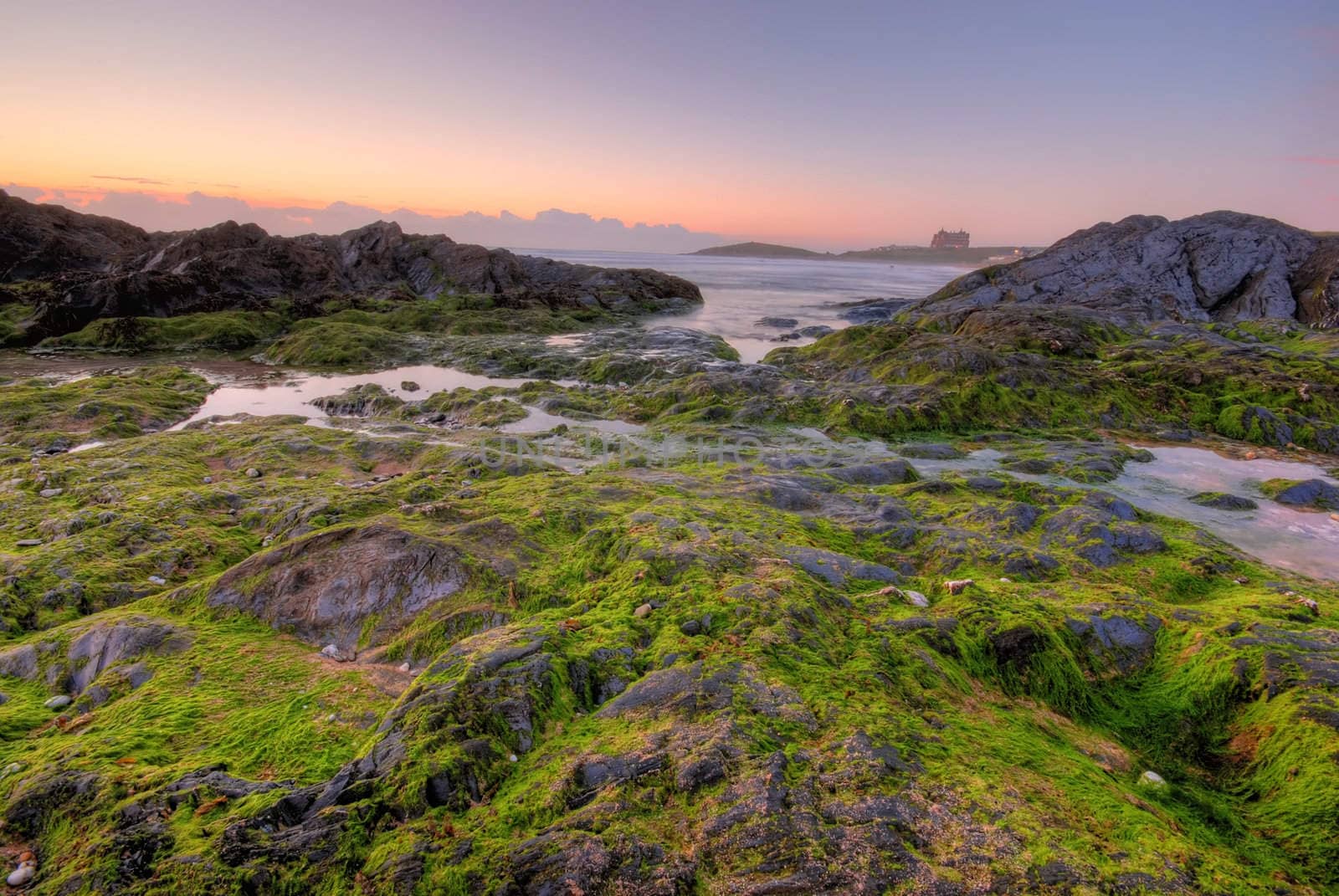 Beautiful sunset by the ocean on Newquay, Cornwall, UK