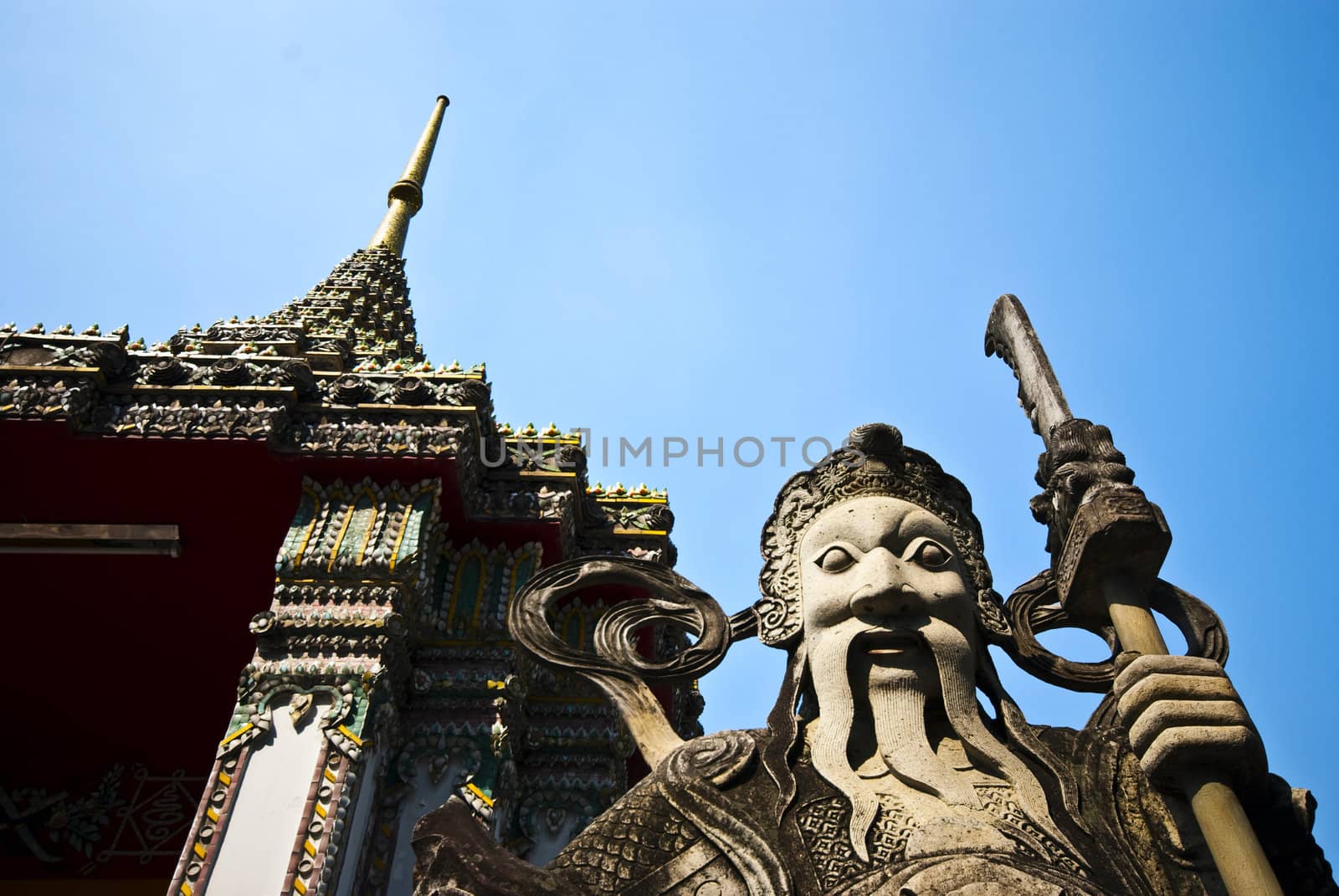 A stone statue at a temple in Bangkok, Thailand