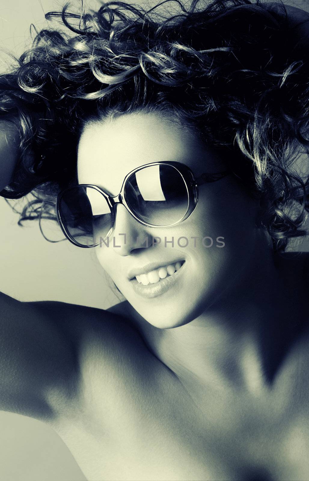 Studio Portrait of a beautiful young woman with glasses - toned in PS