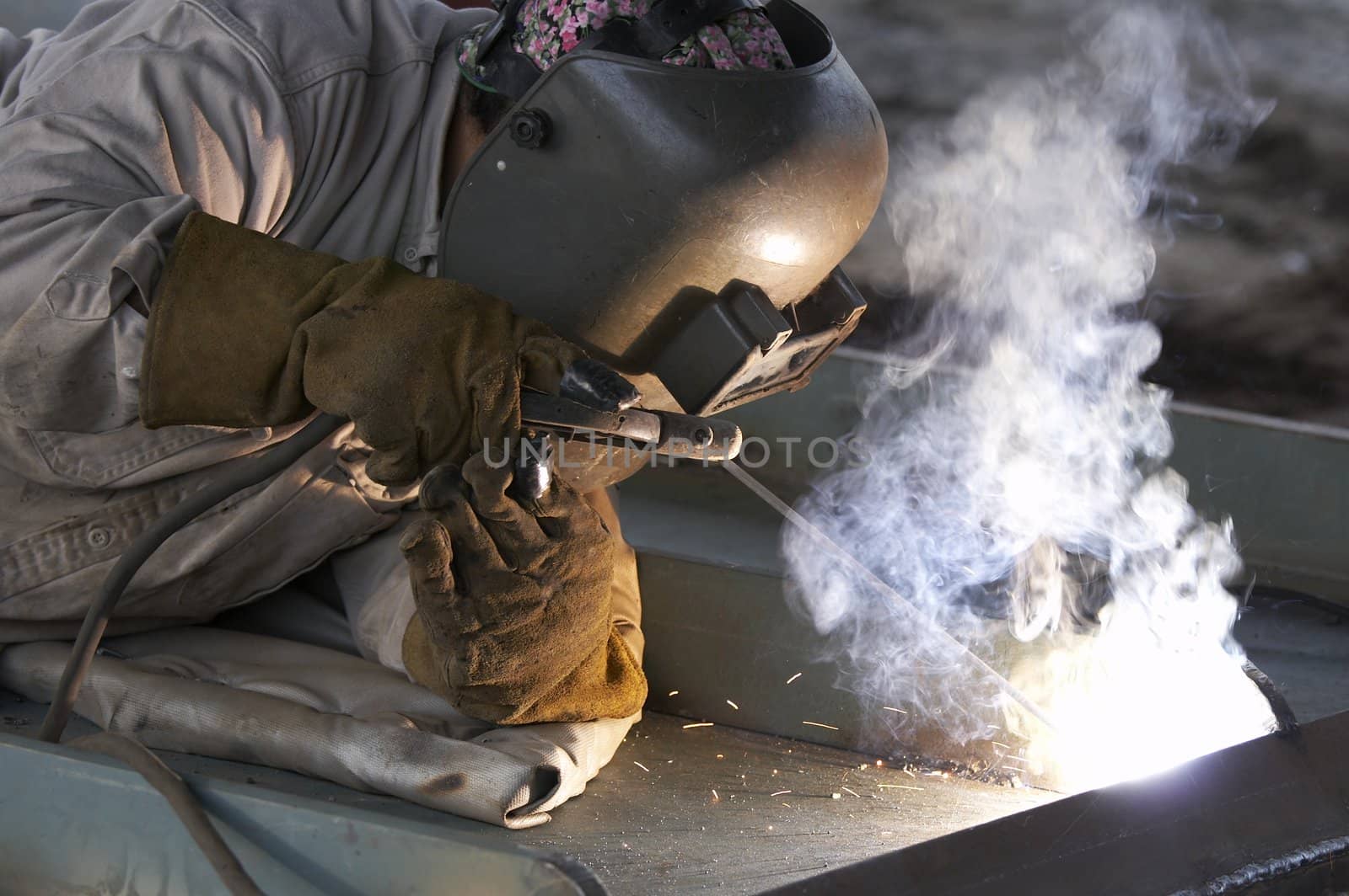 a welder working at shipyard during day shift