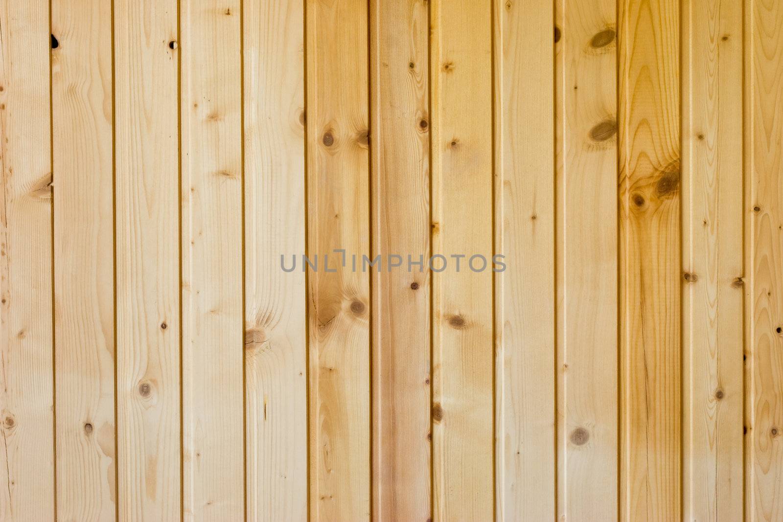 The wall decorated by wooden planks background