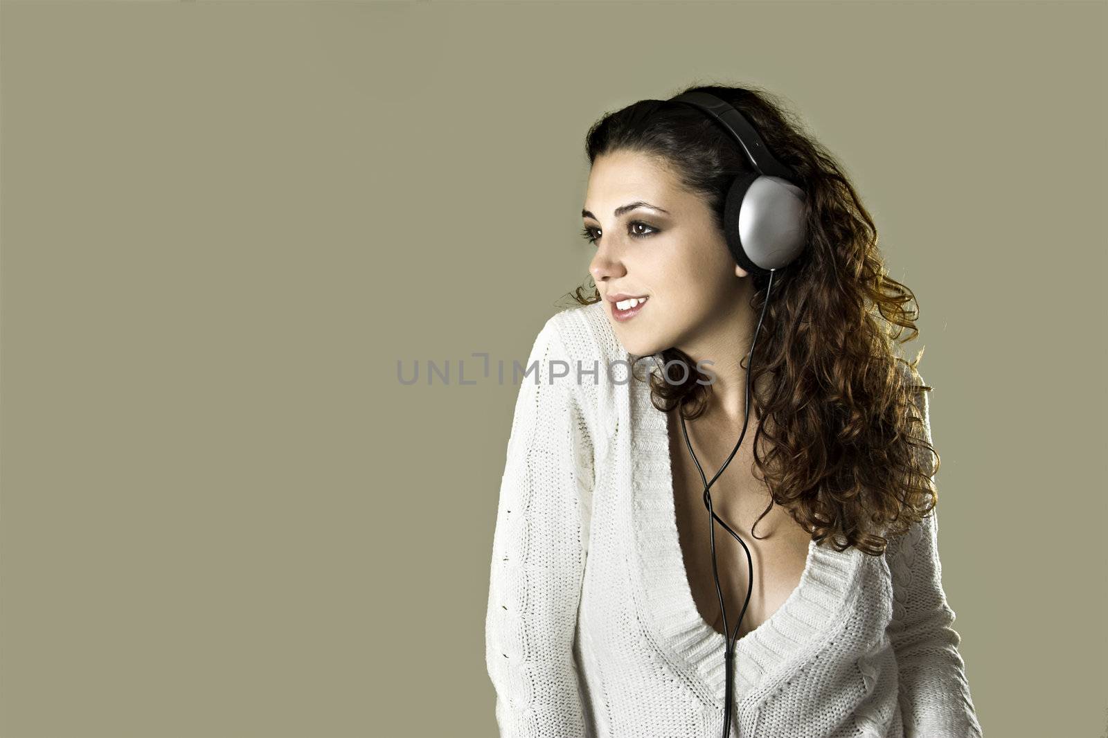 Portrait of a young beautiful sexy woman listening music