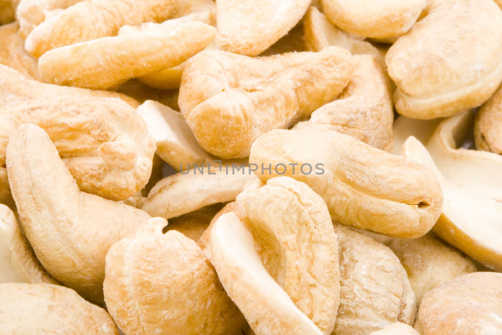 A close-up of a group of cashew nuts.